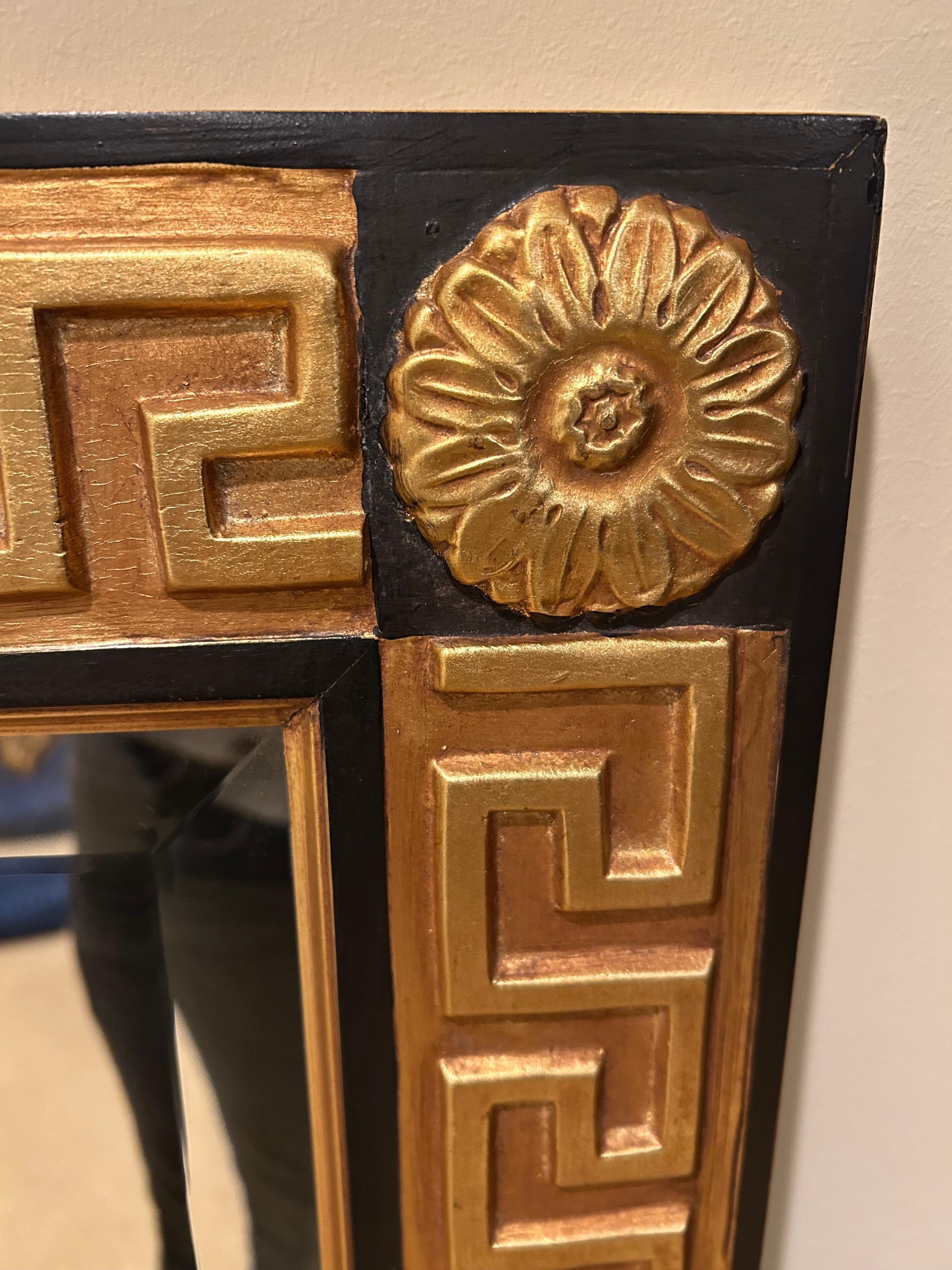 Spectacular large Hollywood Regency style gold leaf and ebonized rectangular mirror with bevelled mirror.  Can be hung either vertically or horizontally.