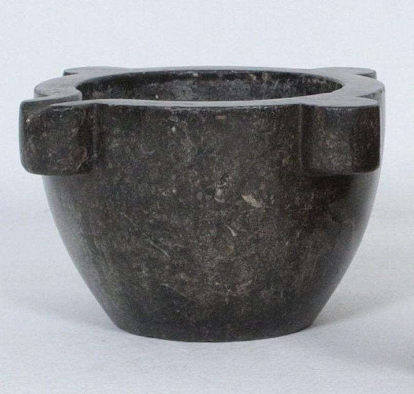 This very large and unique granite stone mortar from the 16th century has a beautiful and rare color palette. This impressive piece has a great patina and character. It looks impressive set in a coffee table or console table.  This is a stupendous