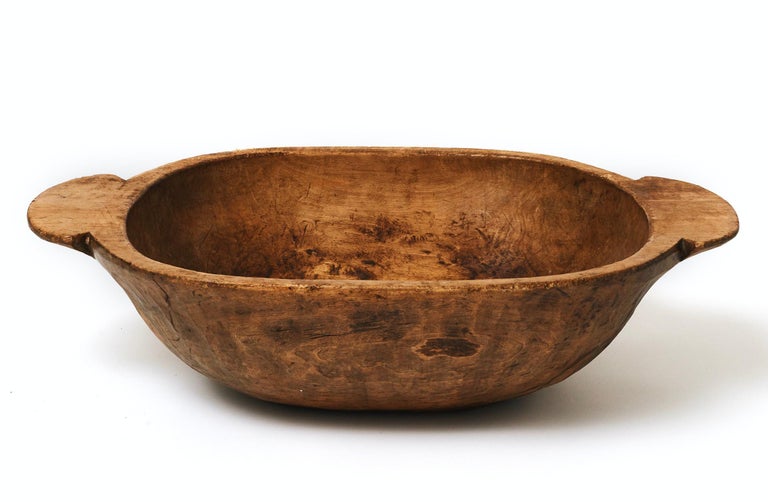 A large hand carved wooden bowl, Probably Eastern European, early 20th century. Good color and patina.