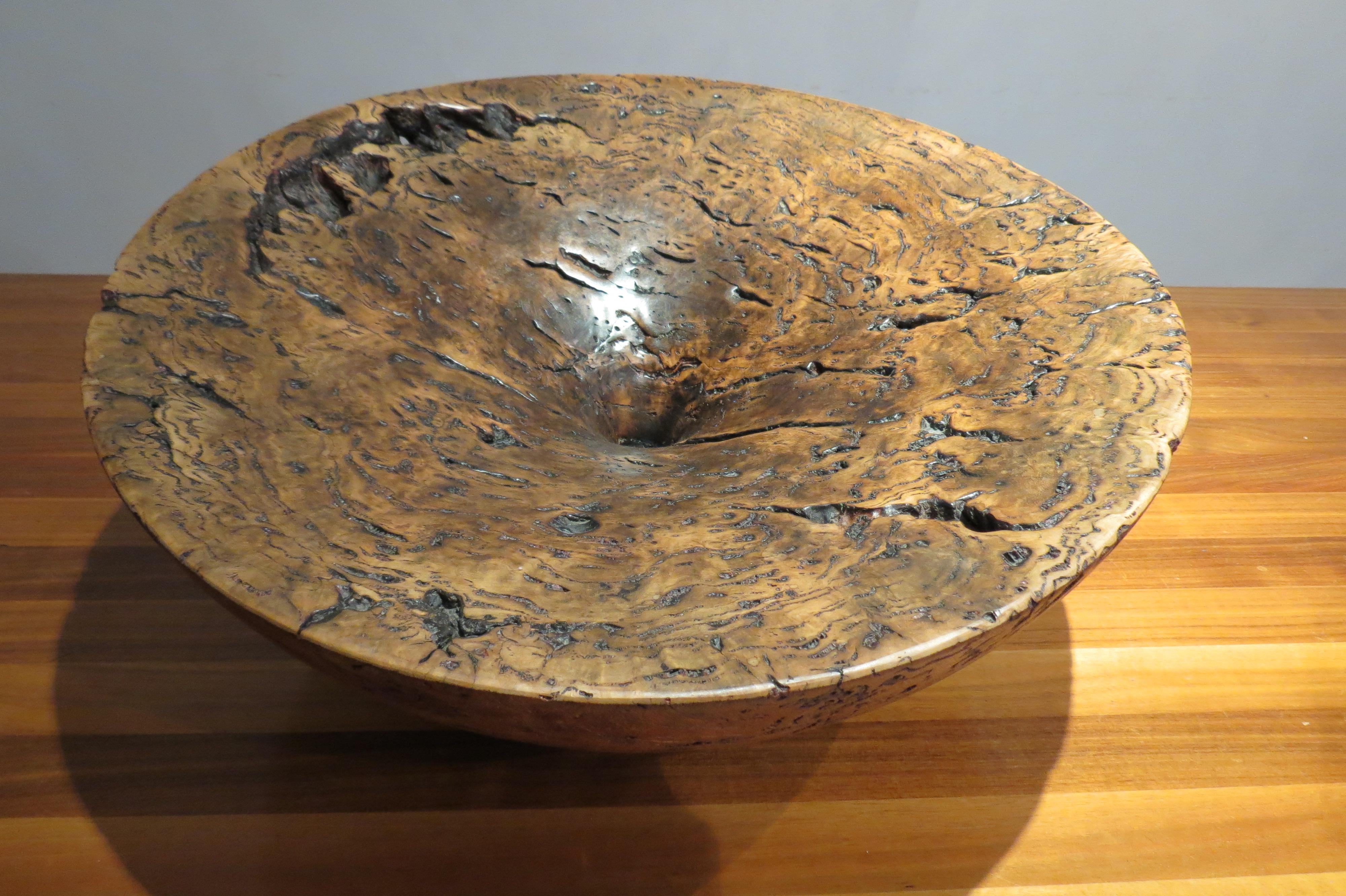 This is an extremely large wooden sculptural bowl made from Tasmanian burr oak. The piece is extremely heavy and only a master craftsman such as Mike Chai would be able to hand turn such a piece due to its size. Beautifully sculptural piece. Stamped