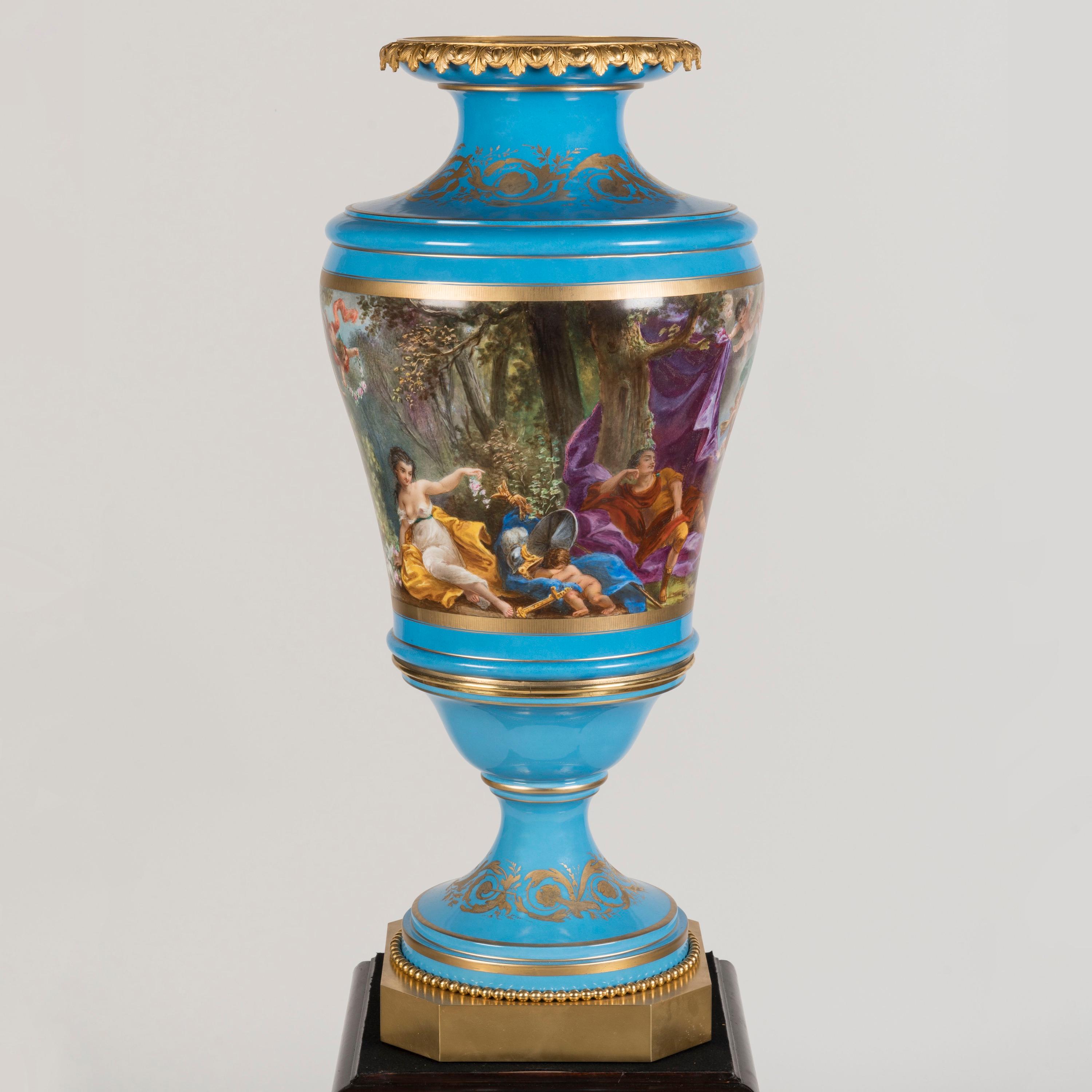 A Large & Impressive 'Sèvres' Style
Porcelain Vase

Standing at three feet tall, the baluster-shaped porcelain vase raised on an ormolu octagonal base with pearl band, and an ormolu stiff-leaf collar at the lip. The decoration scheme carried out
