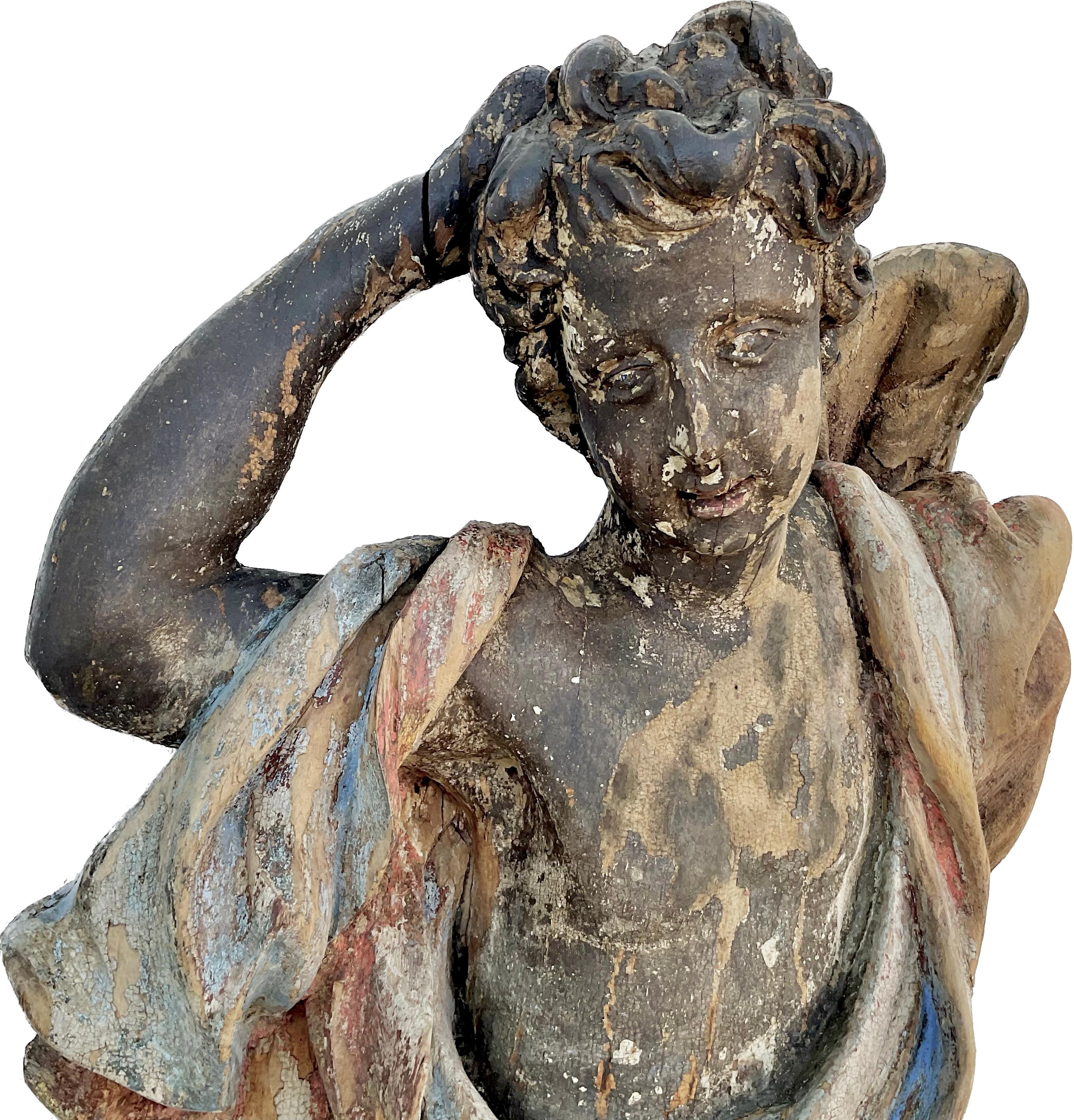 Late 17th/early 18th century carved and polychrome Italian Angel figure. Exquisitely hand carved sculpture with wonderful movement to the draped body of the Angel. Retaining original paint now worn to a perfect patina.