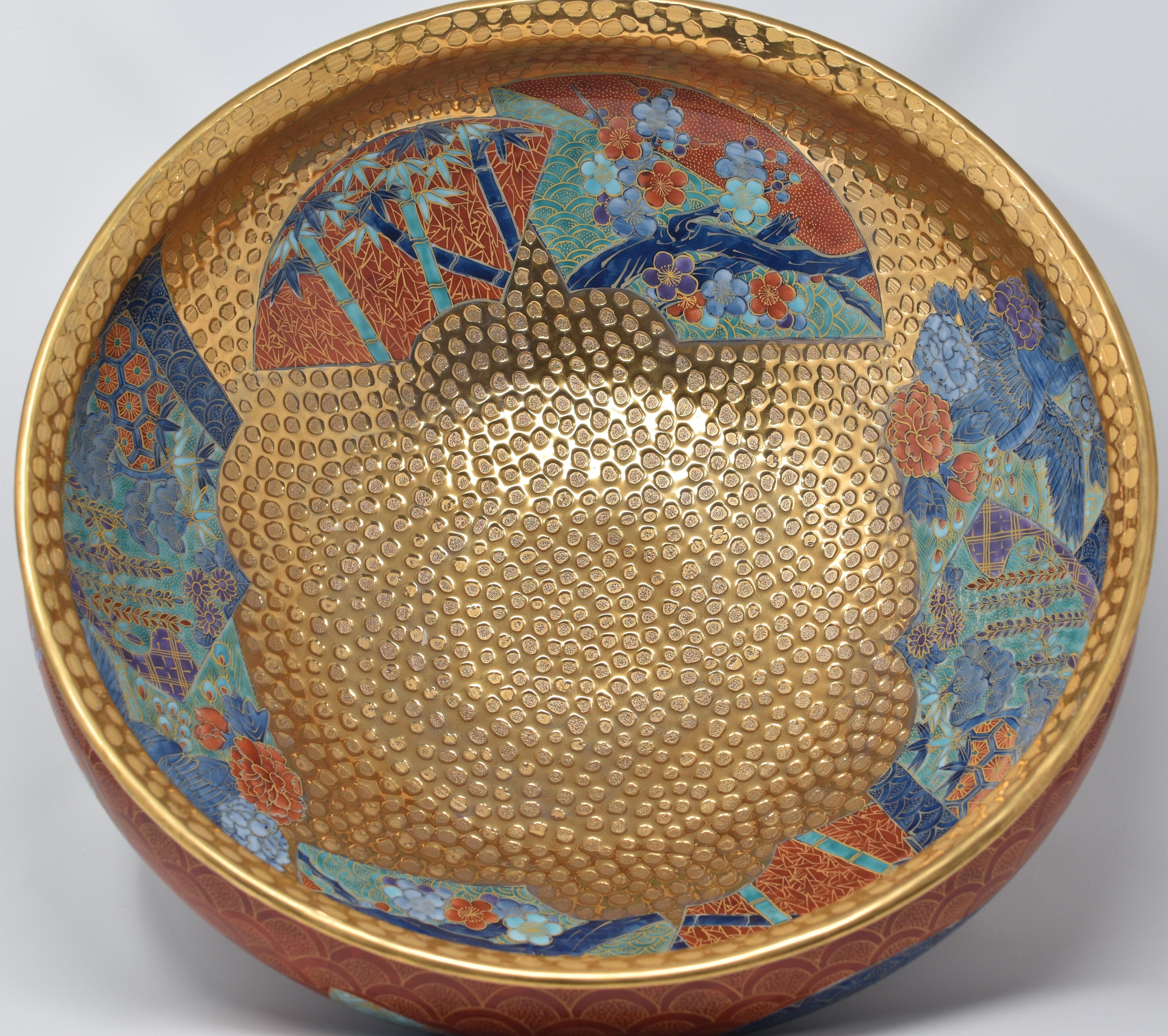 Highly collectible very large contemporary decorative porcelain bowl/centerpiece, an exhibition piece in red and dimpled gold, an outstanding masterpiece by widely respected award-winning Japanese master porcelain artist in the Imari-Arita style. In