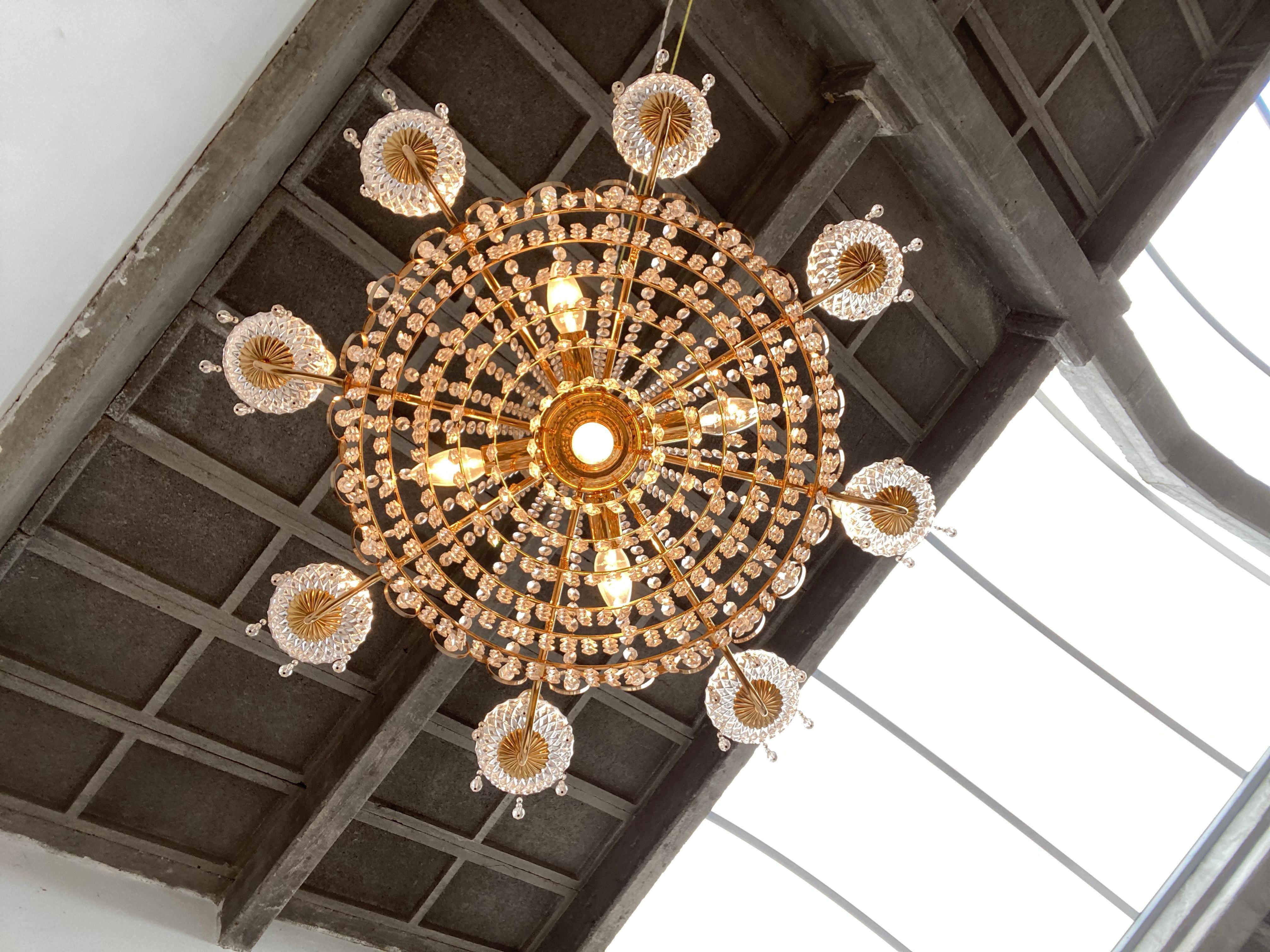 Palme & Walter founded the company Palwa K.G. Gross-Umstadt, Germany and specialised in luxurious lighting 

Their 1960's and 1970's crystal and gilt brass chandeliers have a nice space age detail (ring details) that are almost characteristic for