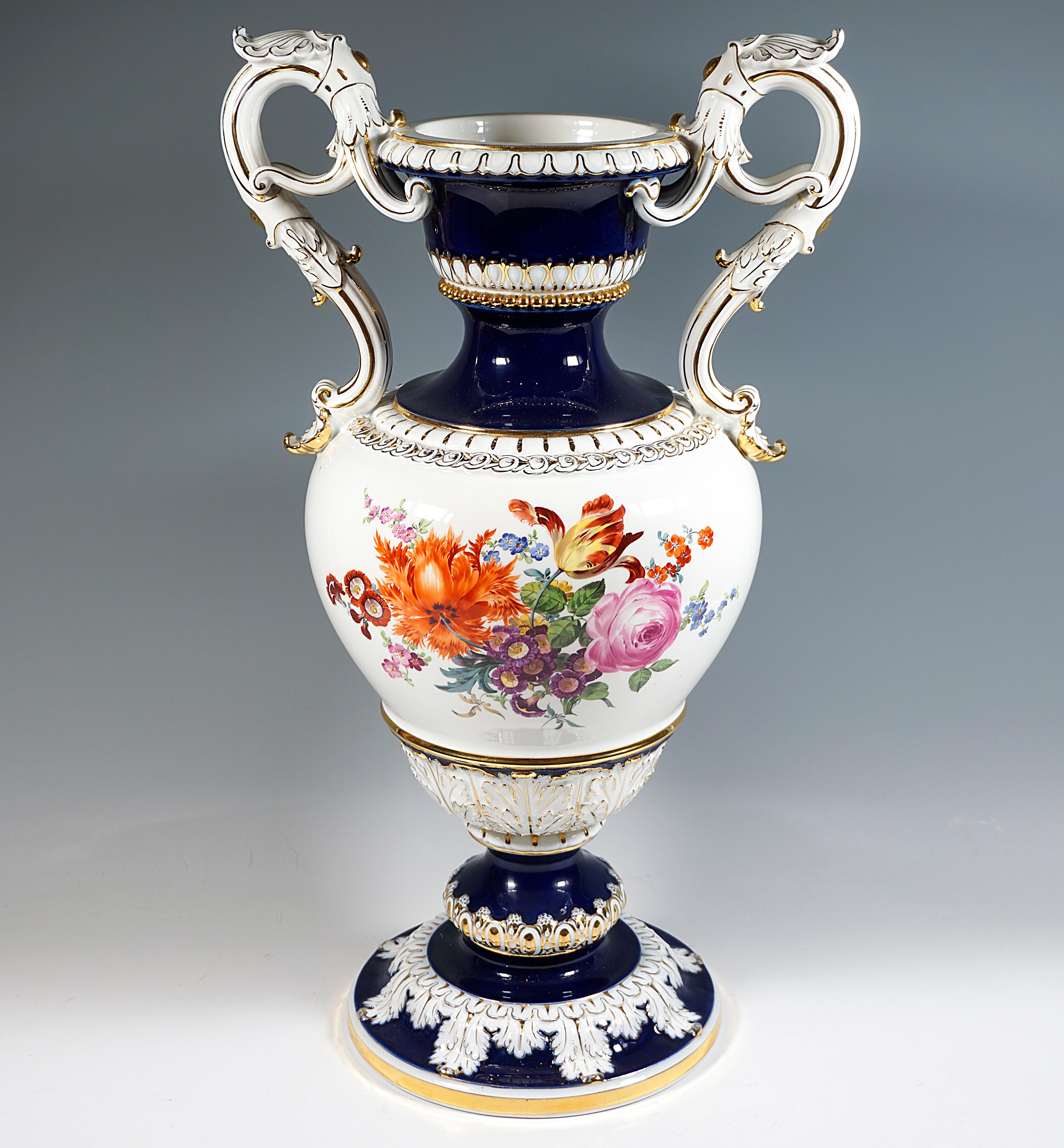 Very large handled vase in baluster form in baroque style on mounted funnel-shaped stand with bead ring in relief, raised handles on the sides in the form of curled acanthus twigs, white background with cobalt blue background painting on the neck
