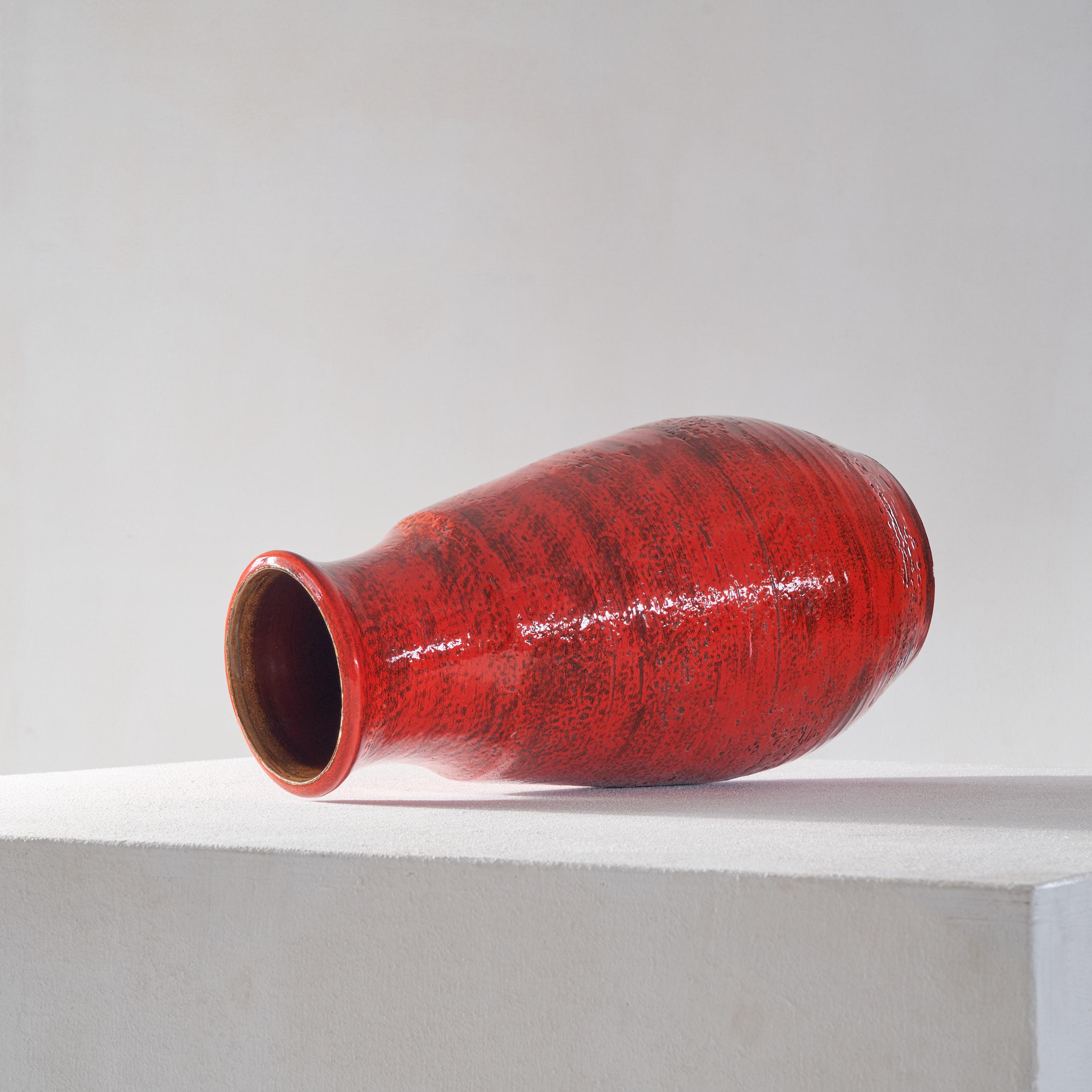 Very large mid century studio pottery vase in bright red. Europe, 1960s.

This stunning mid century studio pottery vase is a true masterpiece of ceramic art. Standing at a substantial size (51cm in height), this vase is sure to make a statement in