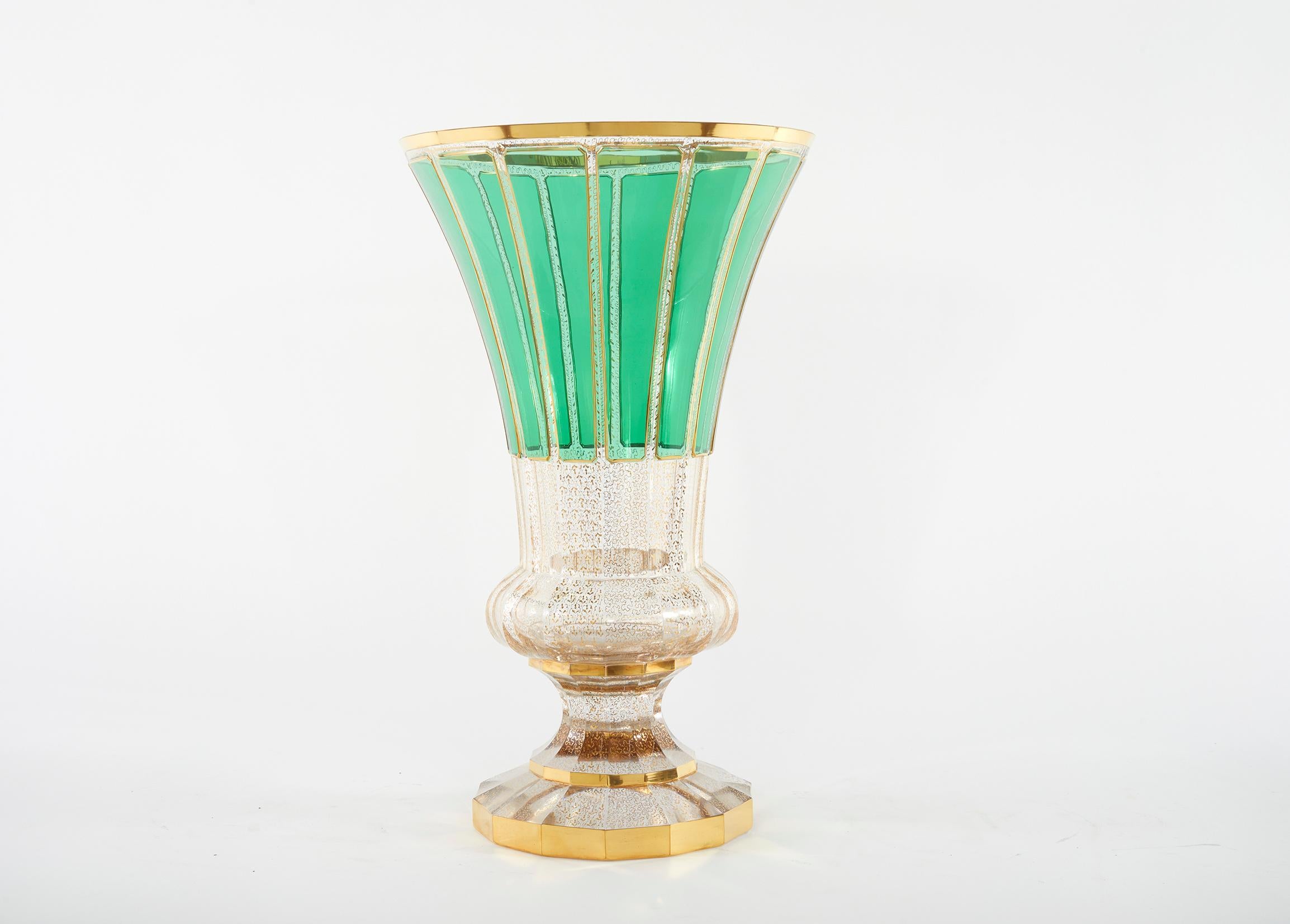 Very large and beautiful Moser Enameled green paneled with gilt gold design details decorative vase / piece. The vase is in great condition. Minor shelve wear underneath. No flaws observed, the decoration is bright & intact. The piece stand about