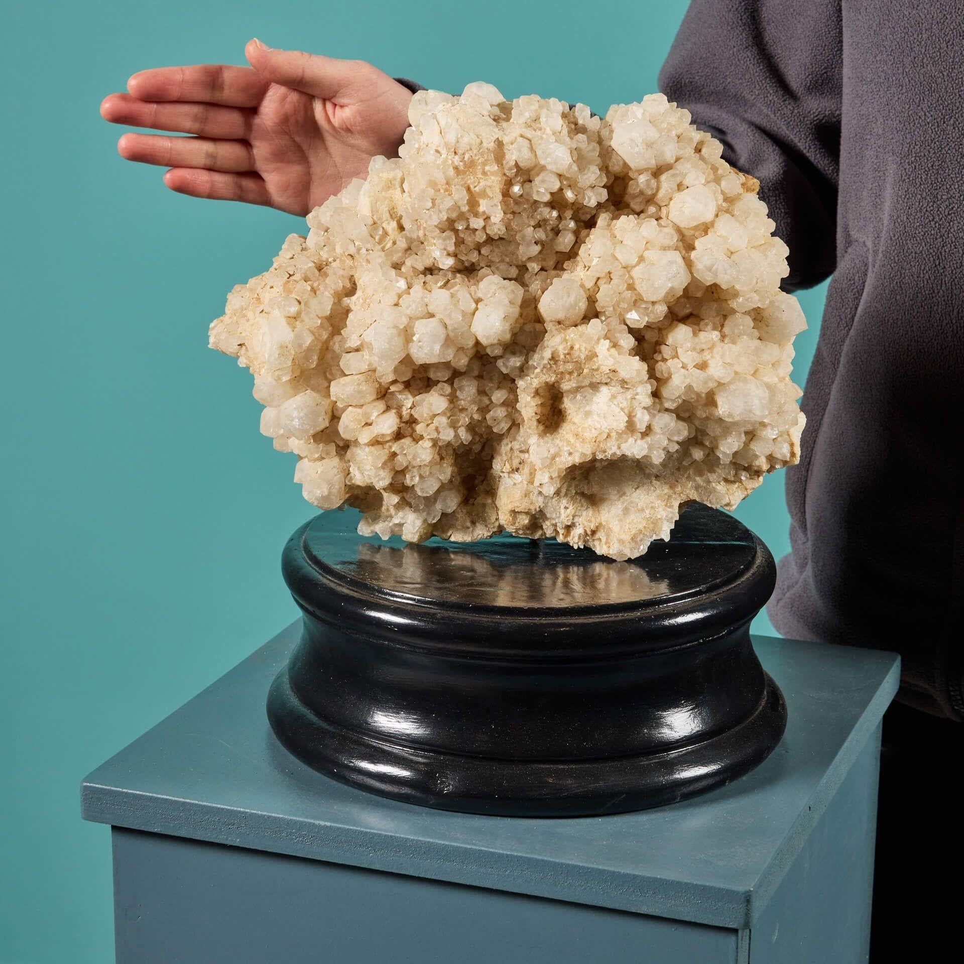 A very large cabinet natural quartz specimen originating from Madagascar and presented on an exclusive painted plaster display plinth. This superb mineral is a stunning and unique specimen of quartz, formed by nature over thousands of years. It