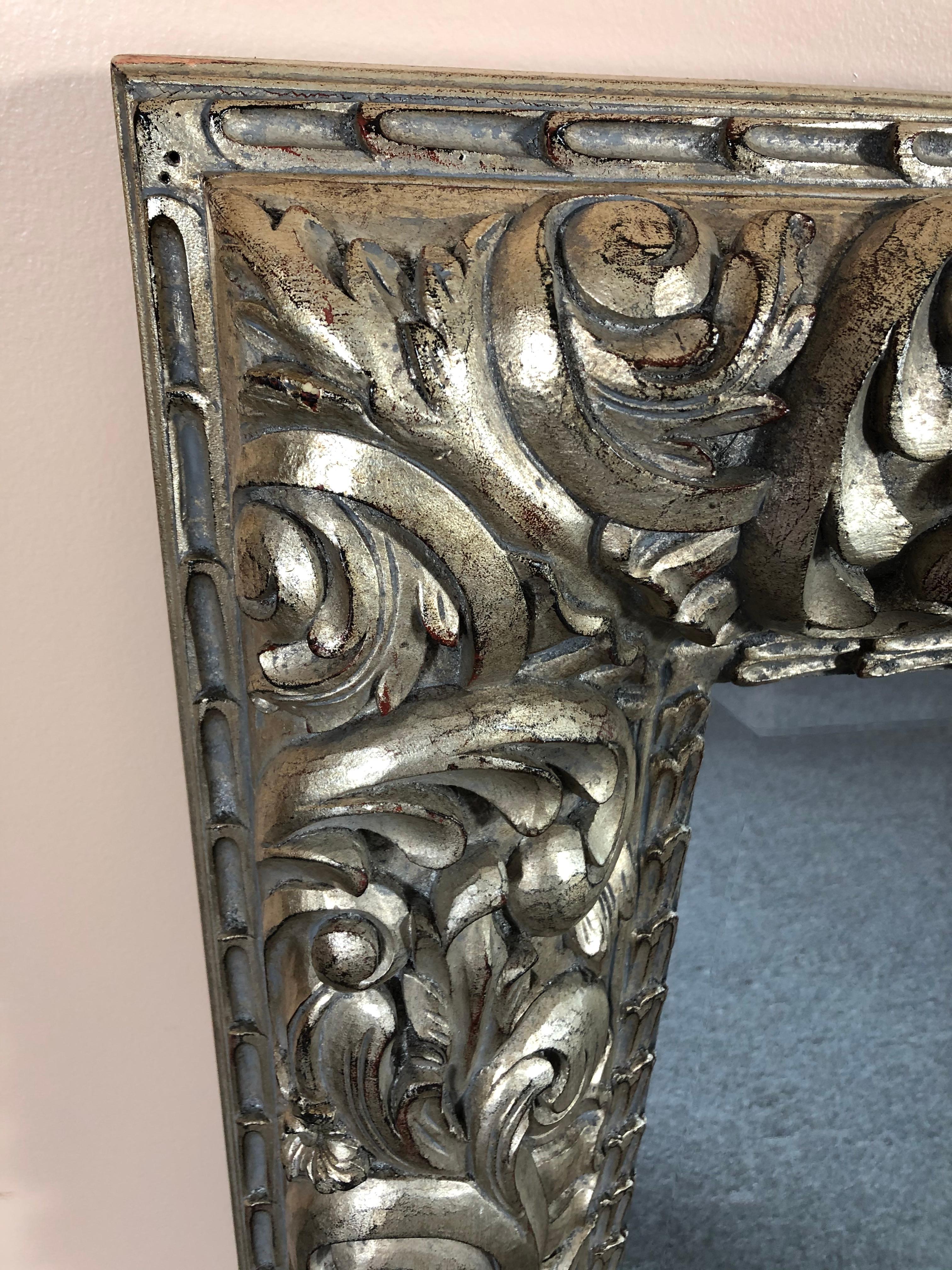 A superstar very large impressive mirror having chunky wide heavily carved silver leaf frame.
Bevelled mirror.
Could be oriented vertically if preferred.