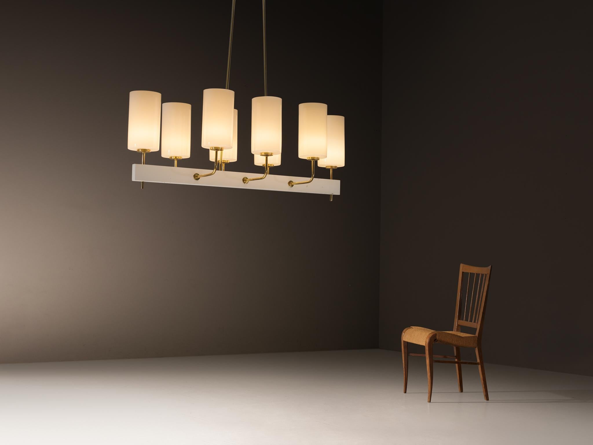 Paavo Tynell for Idman, grand chandelier, lacquered steel, opal glass, brass, Finland, 1963

This substantial chandelier, measuring 155 cm/61.02 in. in width, is designed by the acclaimed Finnish design master Paavo Tynell, showcasing a clear study