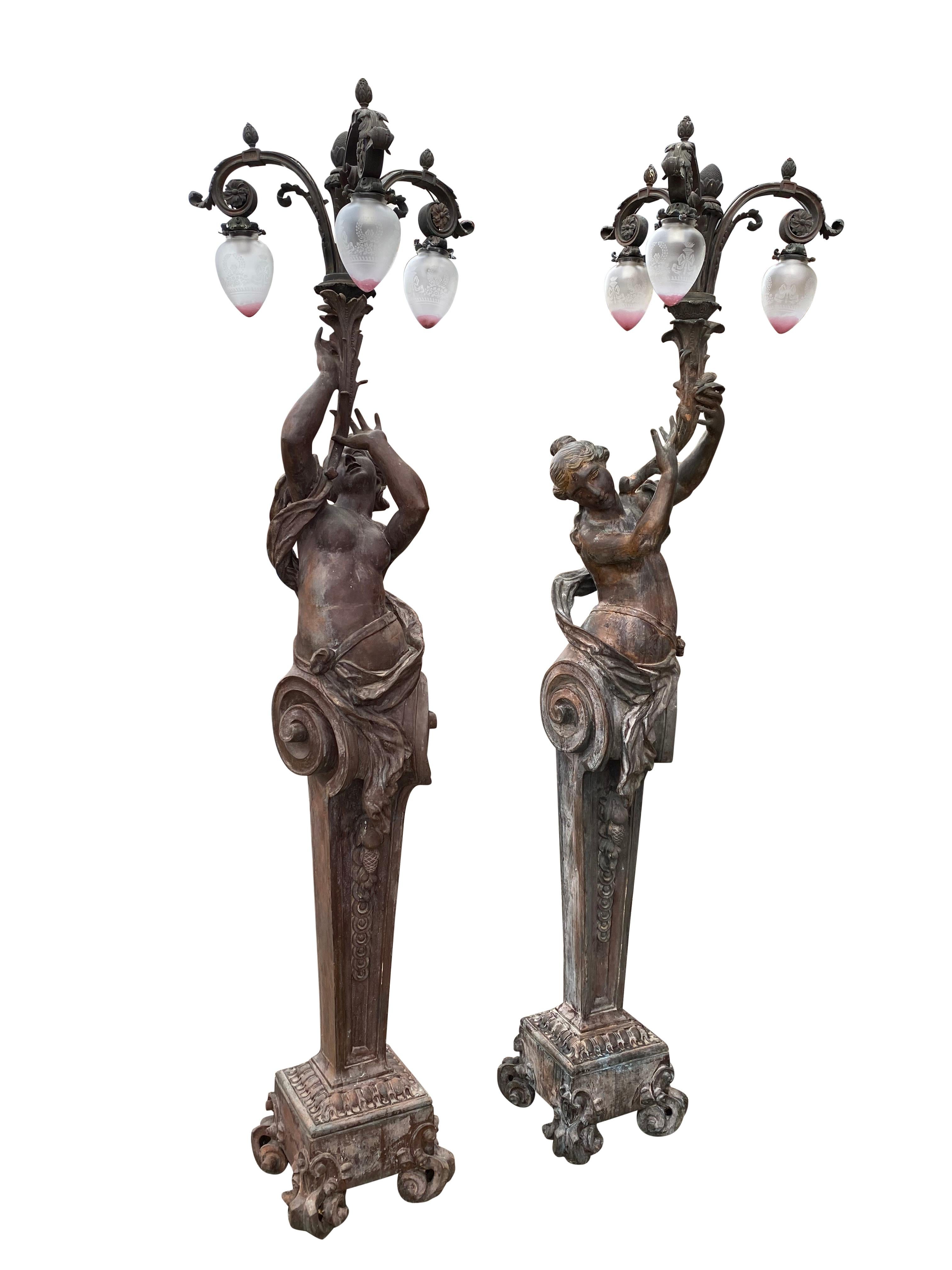 A very large pair of bronze torchère figurative lamps, circa 1920s. Originally from a Viennese theatre house, and removed during the Second World War, where they were stored ever since. We had the lucky opportunity to purchase these recently. They