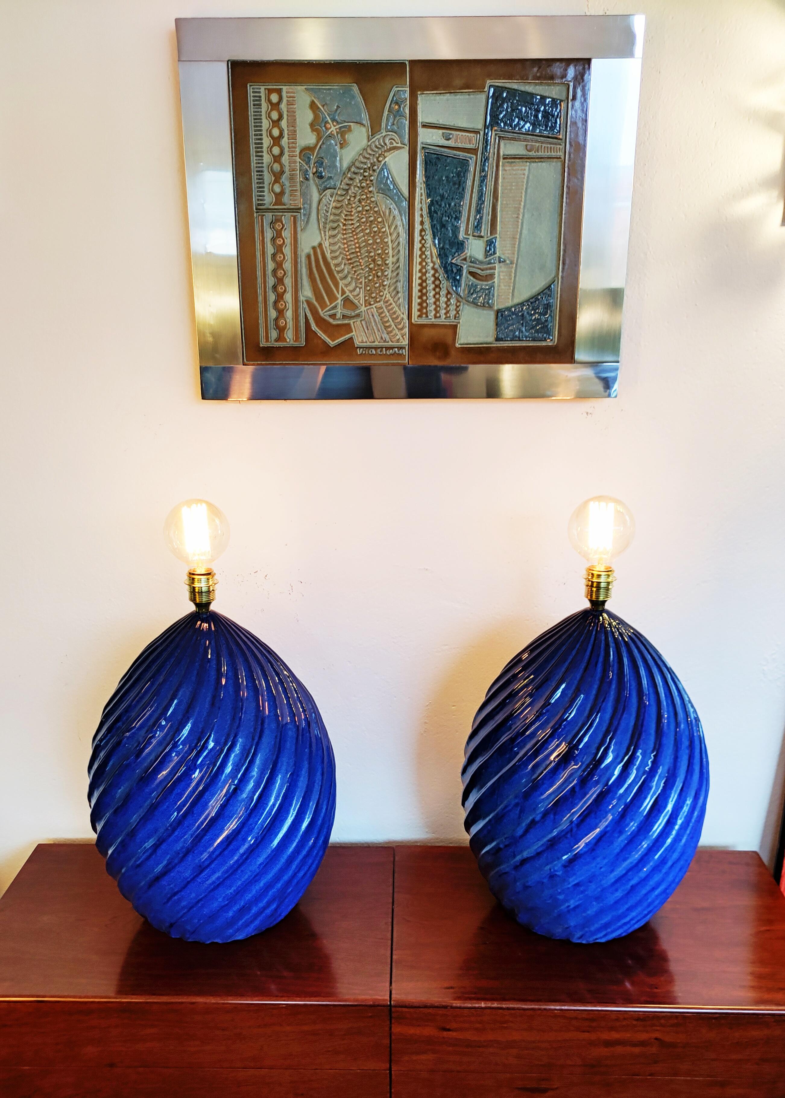 Rare and beautiful pair of very large ceramic table lamp manufactured in Spain in 1970s. Very beautiful deep indigo blue. These ceramics are all signed by the artist at the base. Two pairs available.
