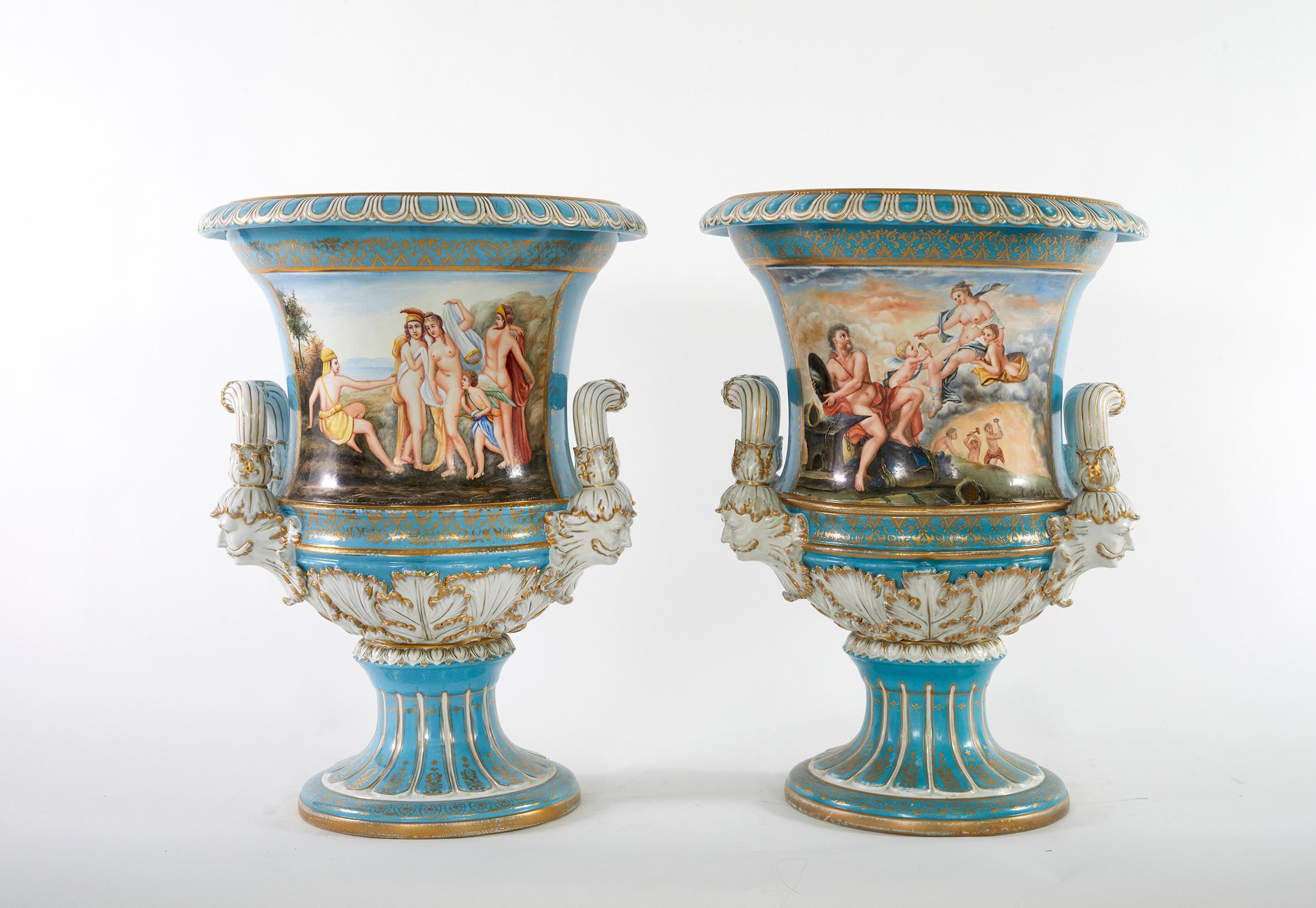 Very large pair Sèvres-Style porcelain decorative Campana Urns / vases. Each vase / urn featuring exterior painted scene design details with two side handles. Each one is in good condition. Minor wear consistent with age / use. Maker's mark