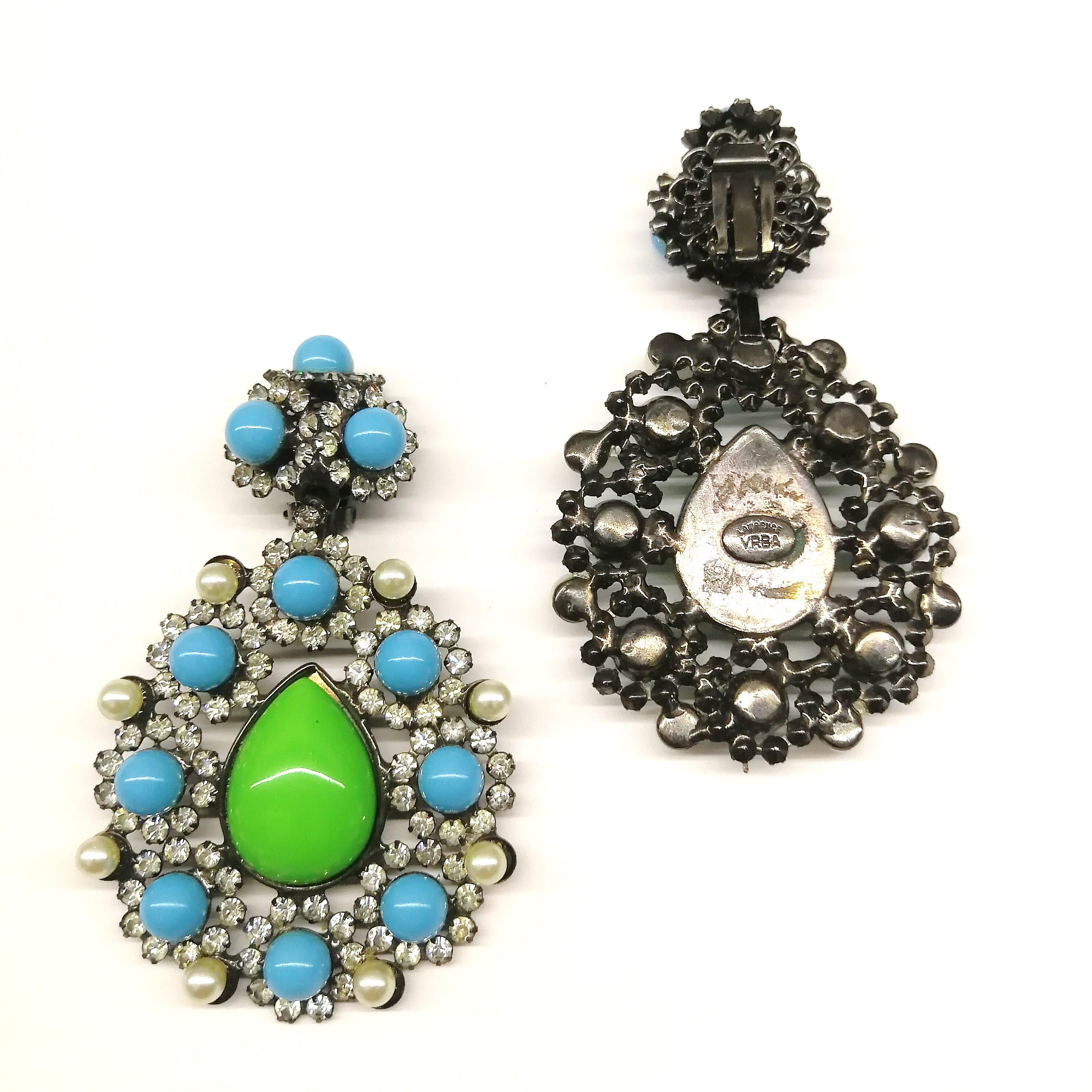 A very striking and exuberant pair of earrings from Lawrence Vrba, the celebrated designer, in a strong colour combination, highlighted and softened by pearls, very reminiscent of 1960s designs. Very glamorous and eye catching, these earrings are