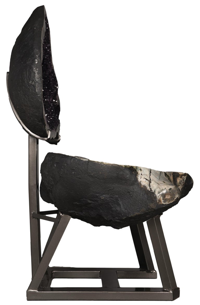 This is an extraordinarily complete geode, split in two and mounted atop a custom metal Stand. This piece celebrates the visual phenomenon of the geode in its entirety, with some parts of the sculpture being rough basalt, and others showcasing