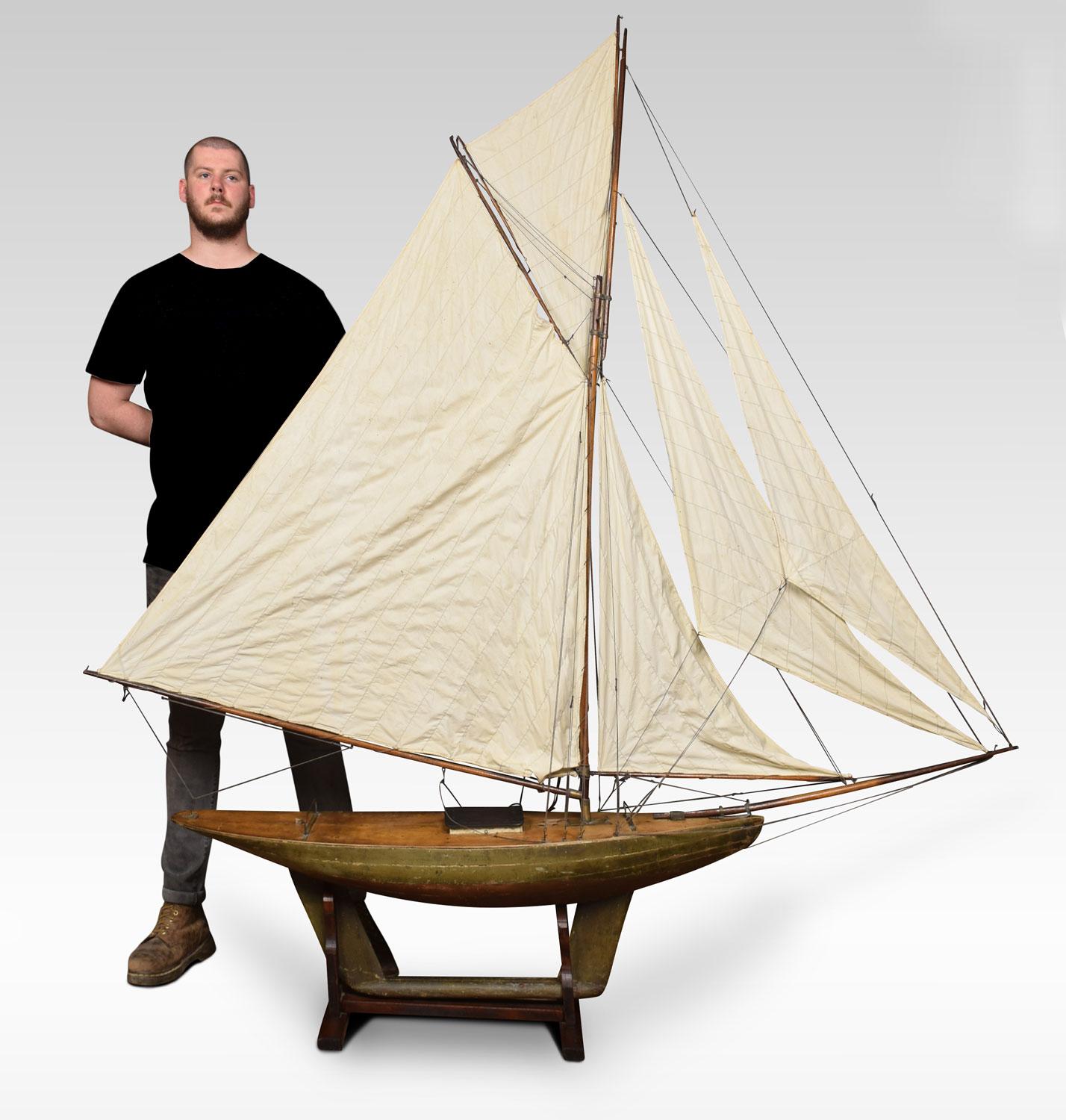 Edwardian pond yacht, painted in green complete with five sails and simulated planked decking.
Dimensions:
Height 84 inches
Width 81 inches
Depth 11 inches.