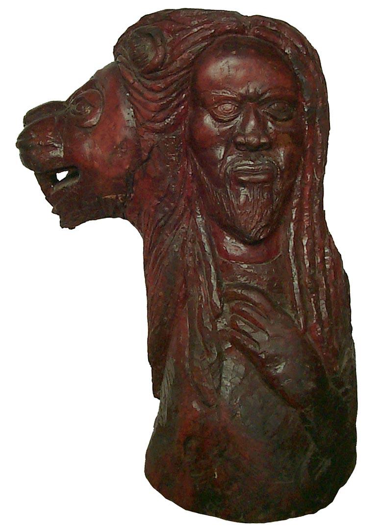 This is a very large, powerful African-American carving of a man and lion. The mane of the lion makes up the man's hair. It stands almost 3 feet high - 33