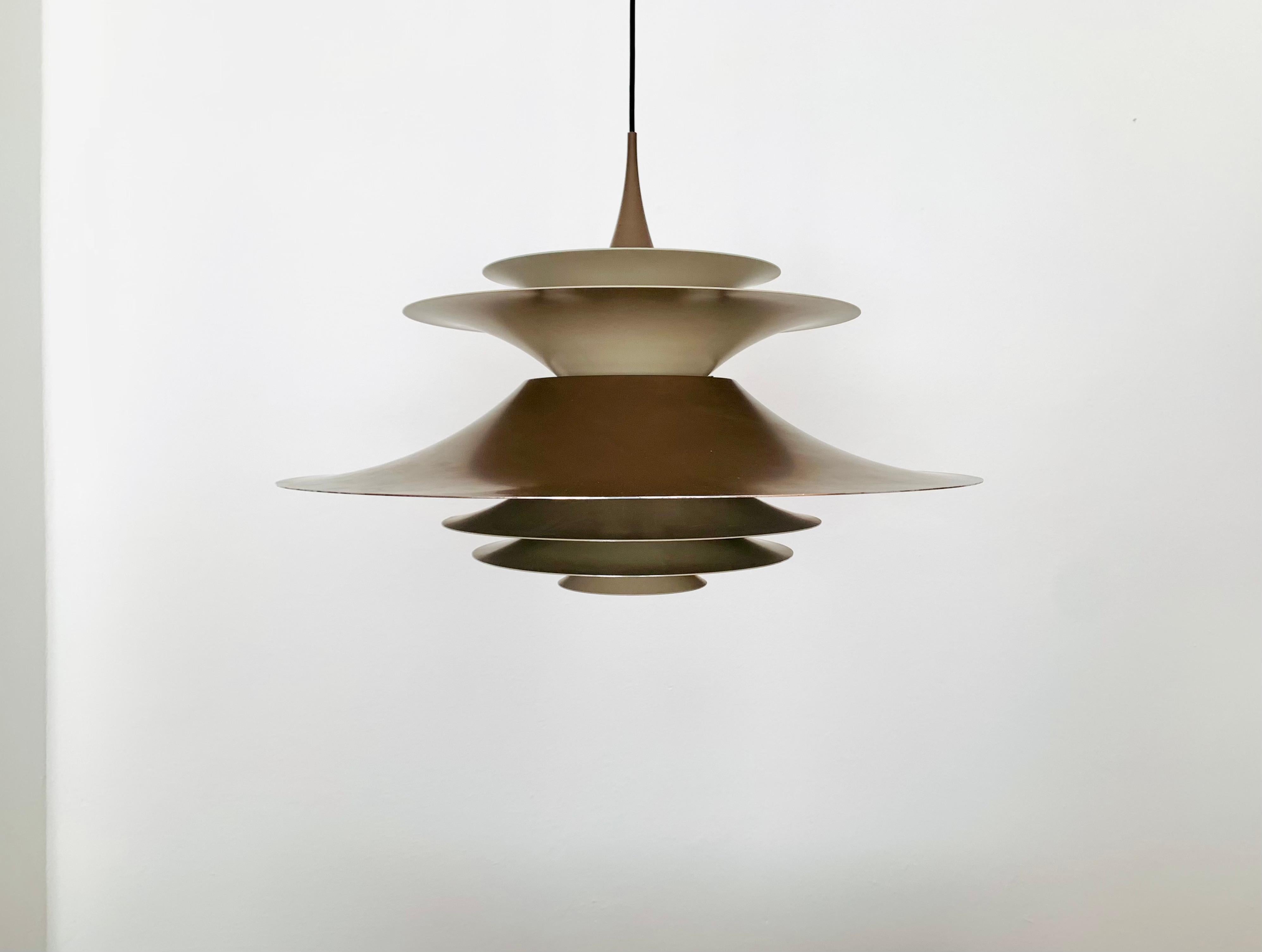 Very large and extremely rare pendant lamp by Fog and Morup from the 1960s.
The lighting effect is extremely beautiful due to the arrangement of the slats, which provide both indirect and direct light.
A spectacular play of light is