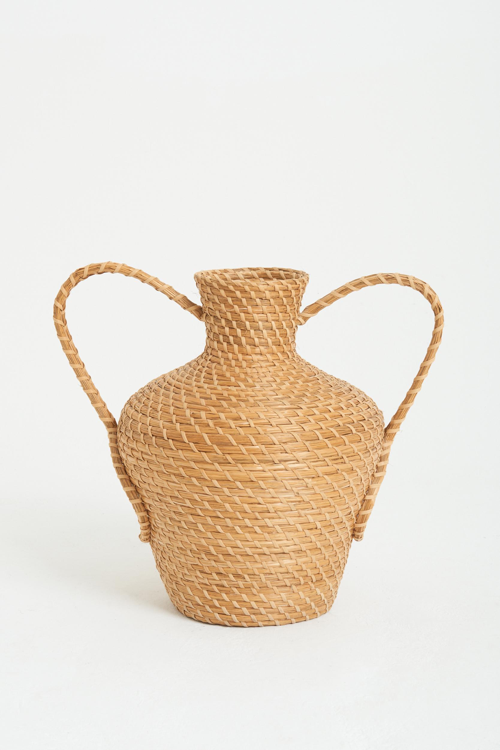 A very large raffia urn with twin handles
France, 20th Century
53 cm high by 60 cm wide by 45 cm depth
