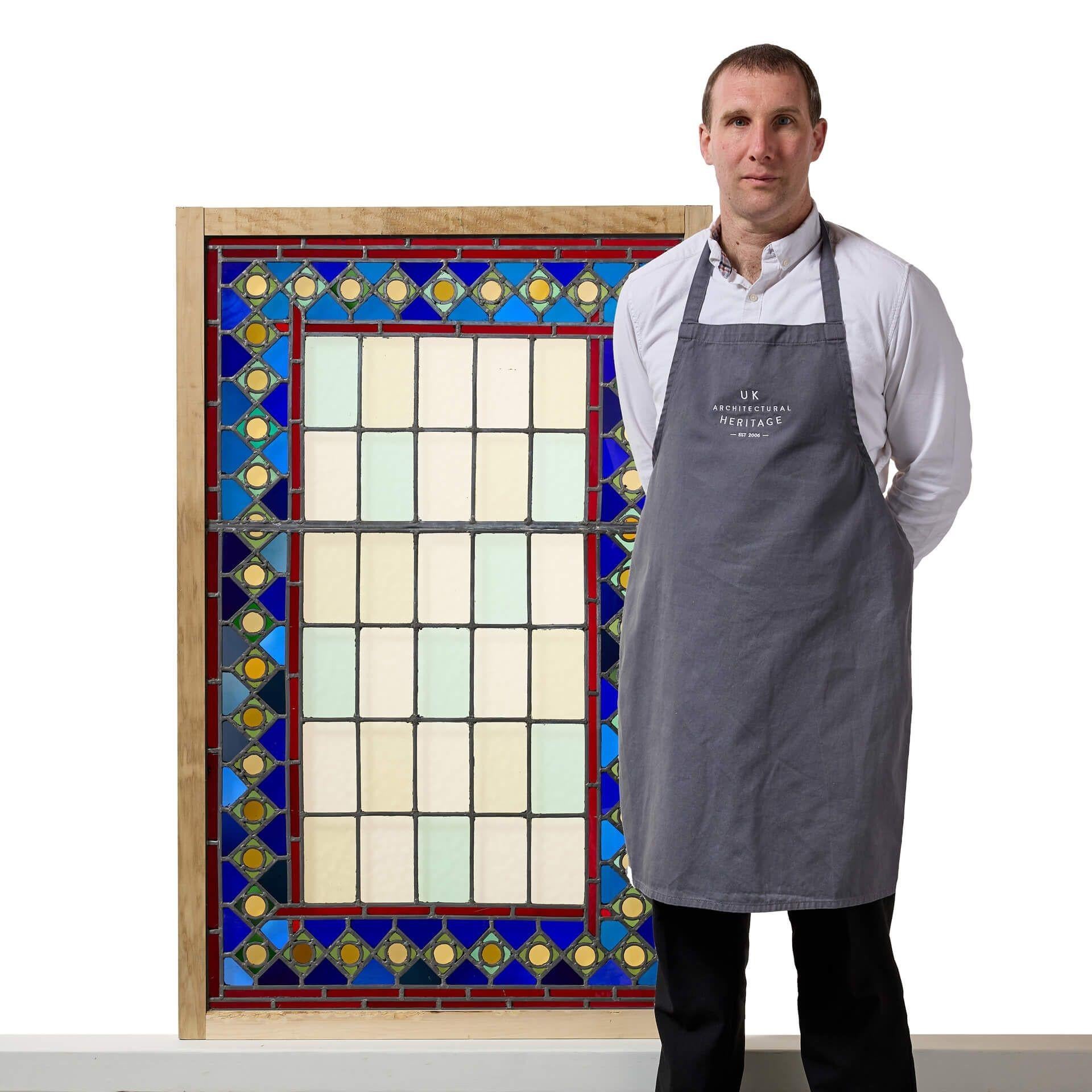 A very large rectangular reclaimed medieval style stained glass window, one of three similar in the same design in different sizes we are selling.
 
This stained and leaded glass panel will make a beautiful feature window in homes modern and