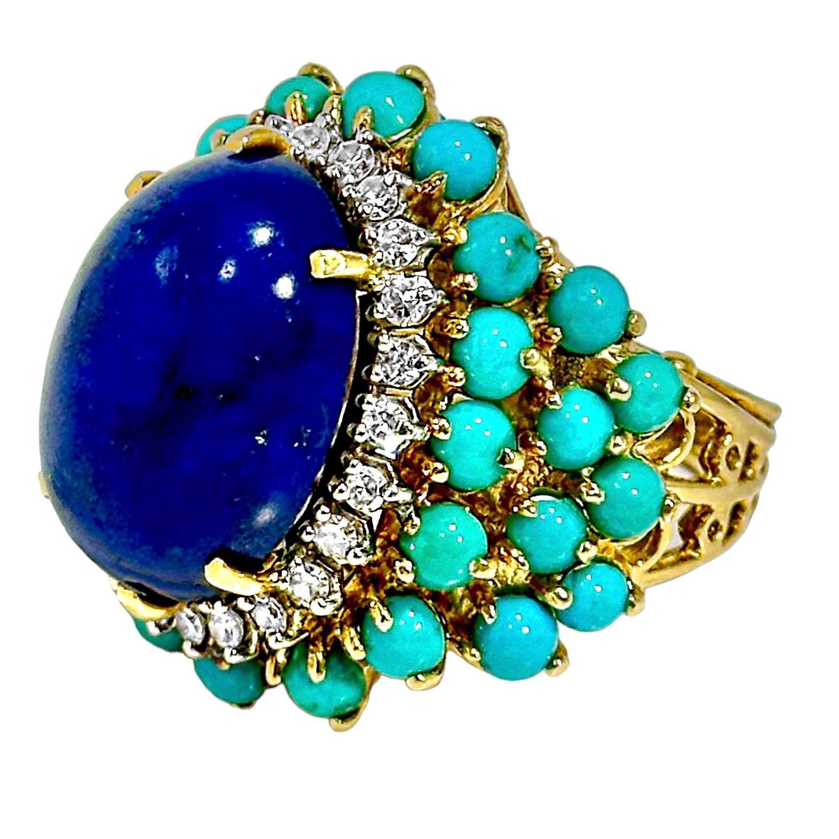 This fabulous 18K yellow gold, mid-century cocktail ring is centered around a deep blue lapis lazuli cabochon measuring 20mm X 16mm. Framing the lapis are round single-cut diamonds, and beyond the diamonds are tiers of round cabochon turquoise. The