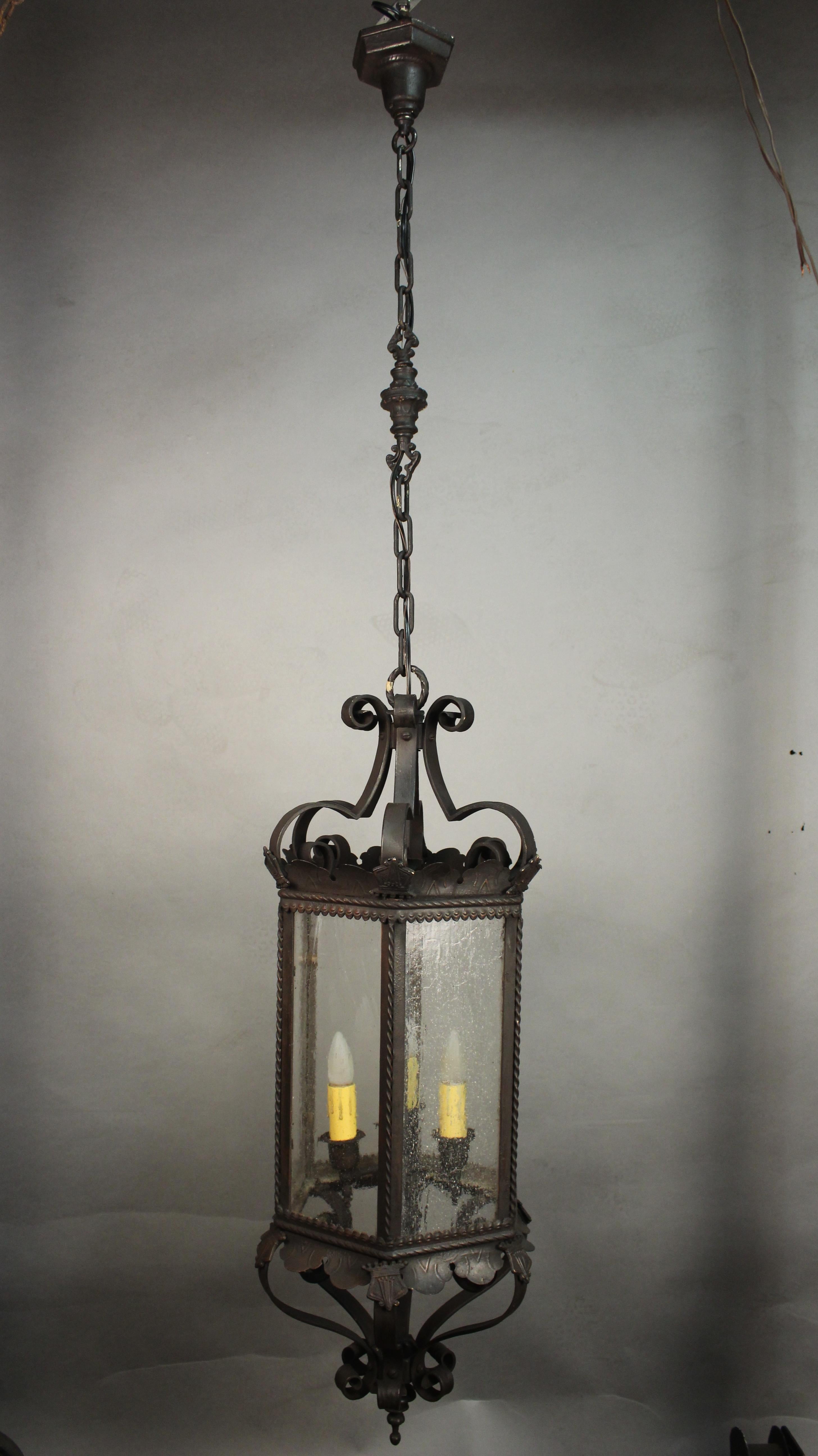 Hard to find three light Spanish Revival lantern. Was hanging in graceful staircase of an original 1920s house. Measures: 39