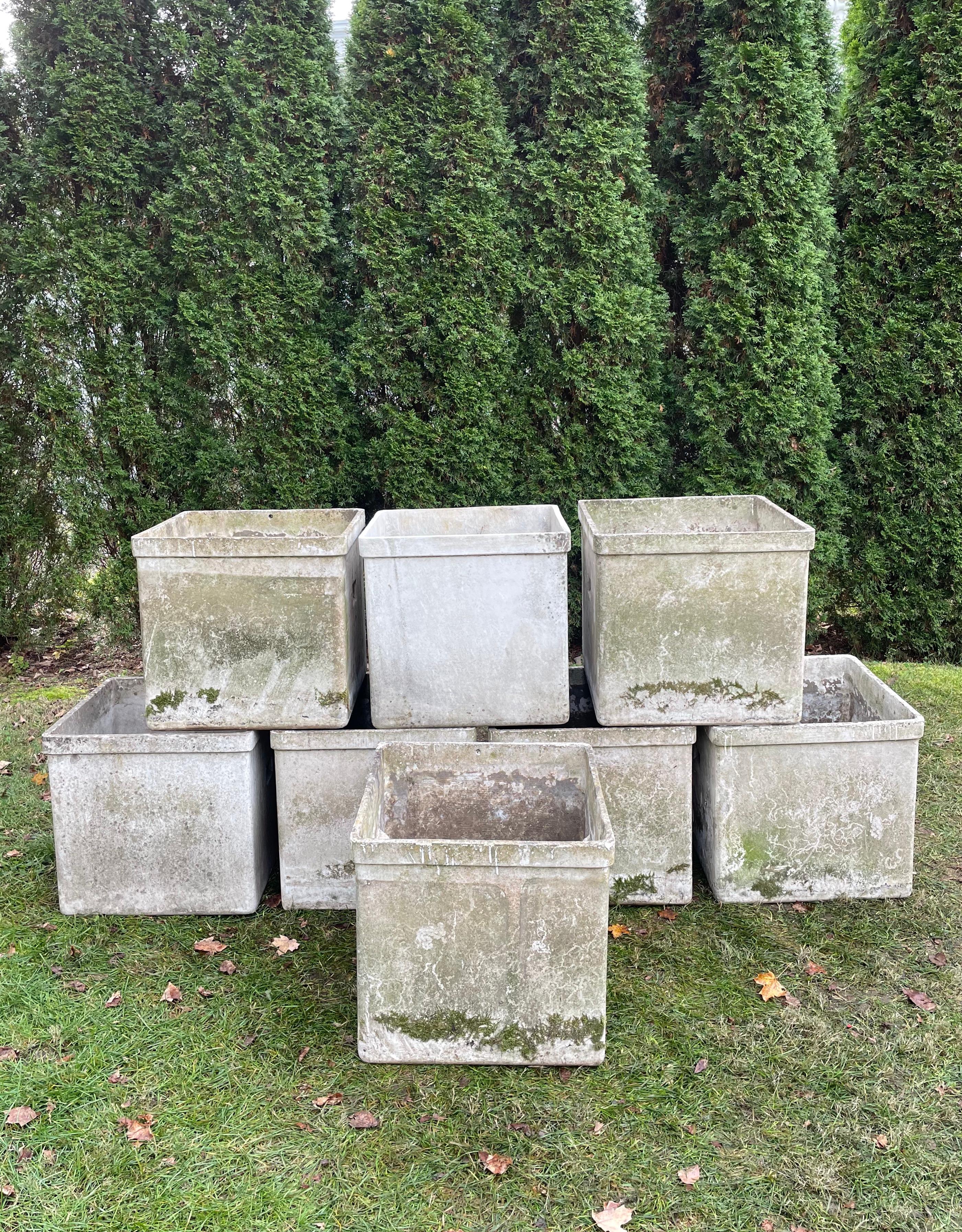 Designed by the iconic Willy Guhl in the 1960s and made of strong and lightweight fiber cement, these numbered planters with embedded handles are impressive for their size, condition and patina. Plant them up with low mounded moss or sedum for an