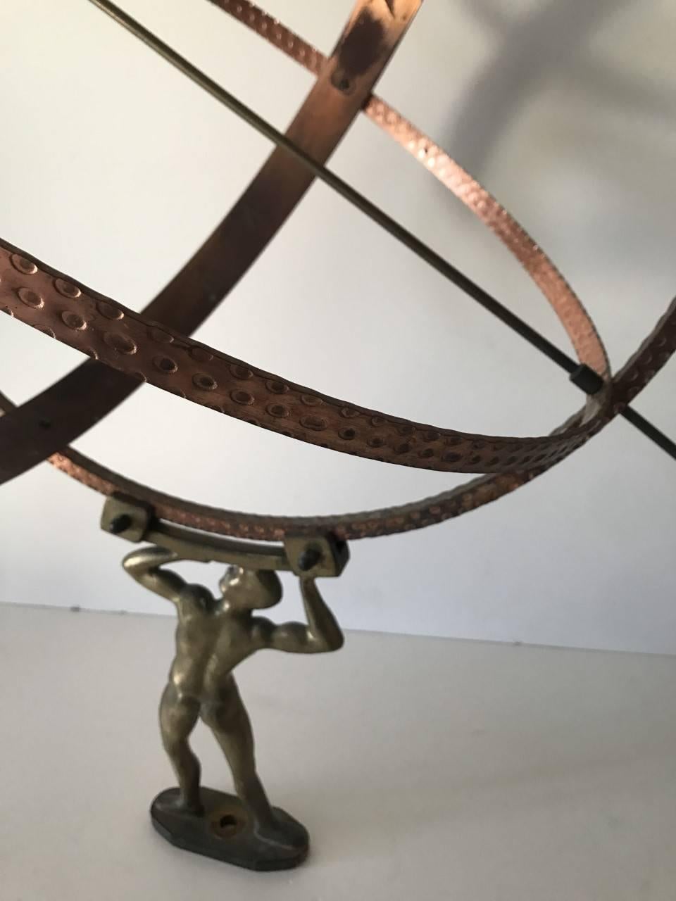 Very large Swedish copper and brass sundial 1960 with Hercules holding a sphere.
This is a very large sundial and for use in a garden, it has a metal base with drilled hole so that it can be fastened to a foundation, preferably a stone, rock or