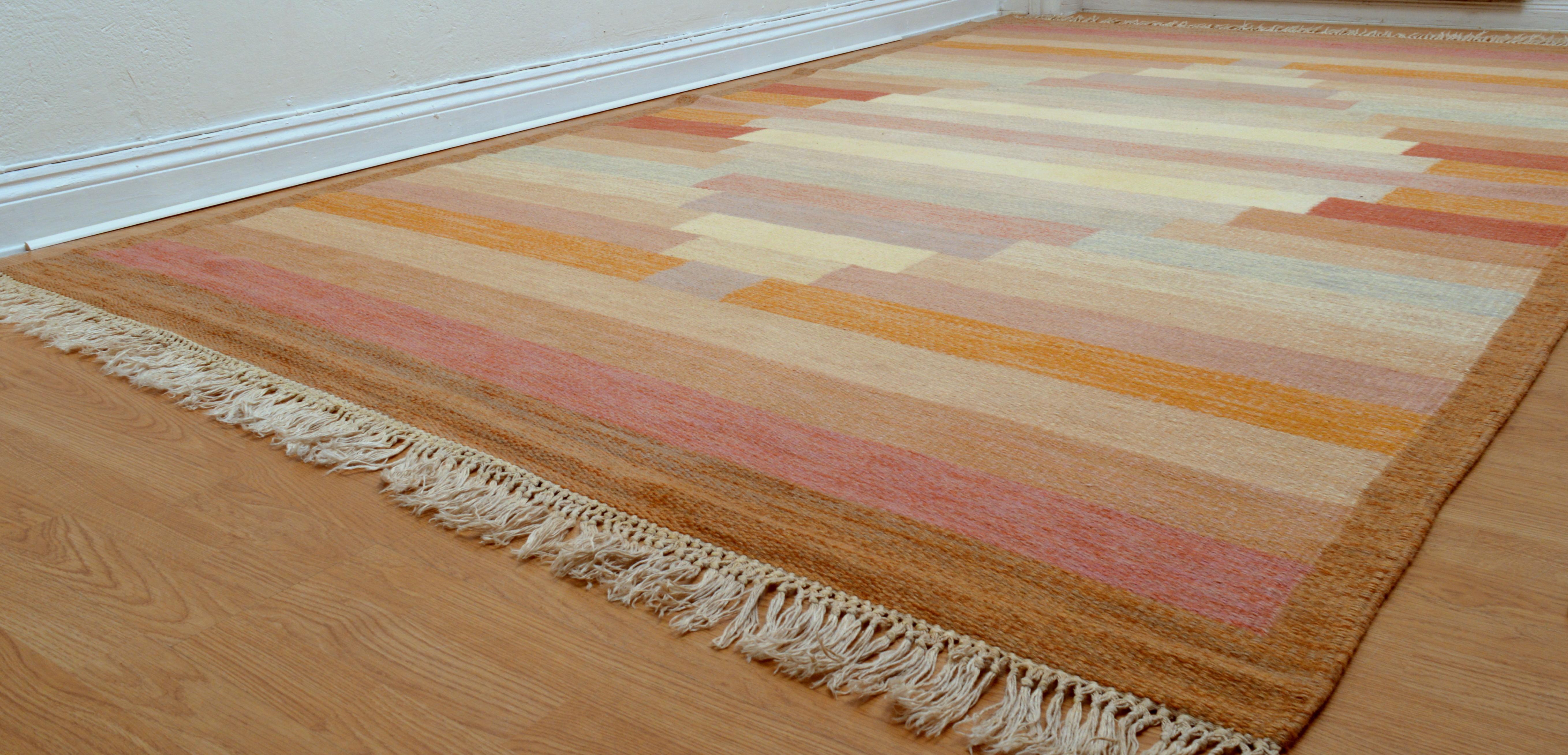 A large flat-weave rölakan carpet / kelim rug named 
