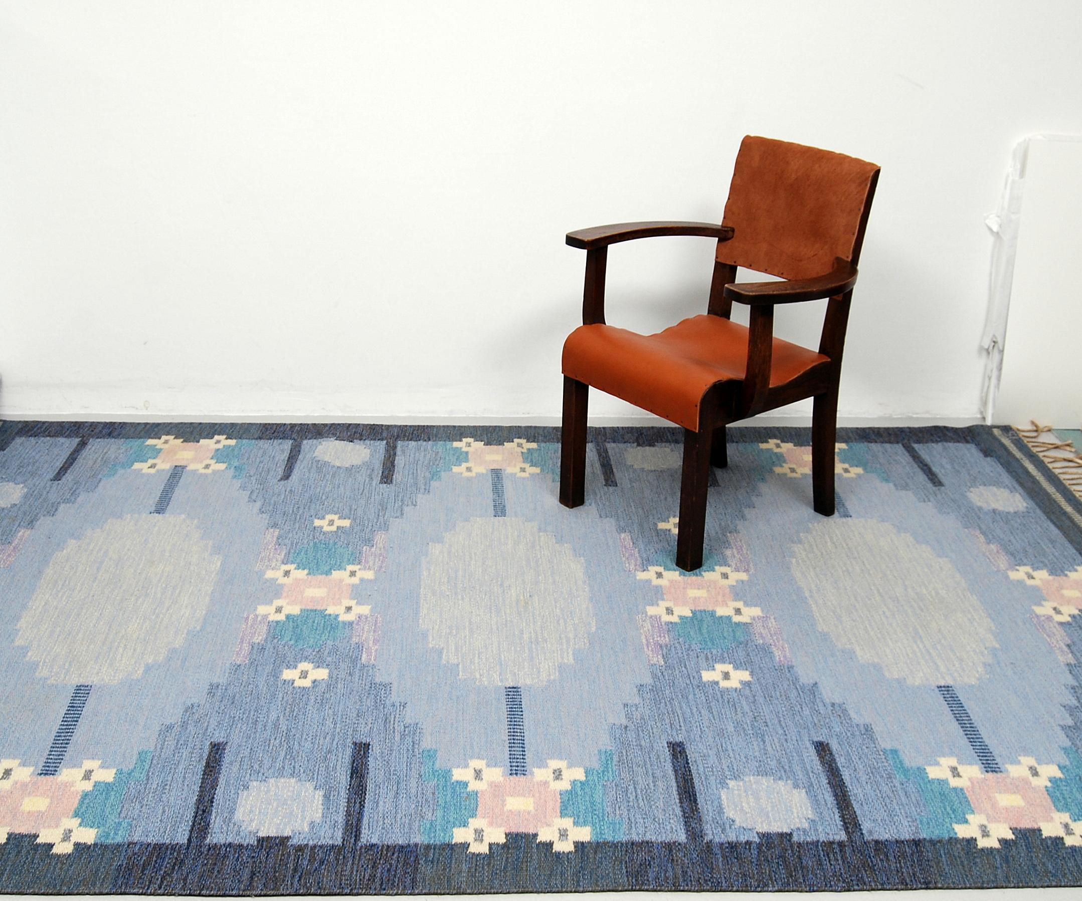 A large flat-weave rölakan carpet named 