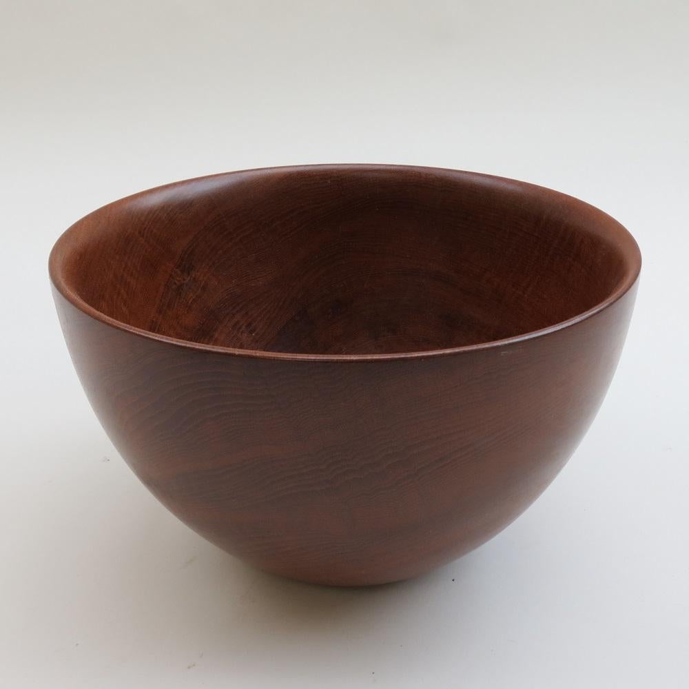 Very large wooden bowl, hand produced in solid Teak. 
Stamped to the underside Galatix Burma teak handmade Made in England.
Bowls produced by Galatix come in varying sizes, this is the largest I have seen. Wonderful example.

In good vintage