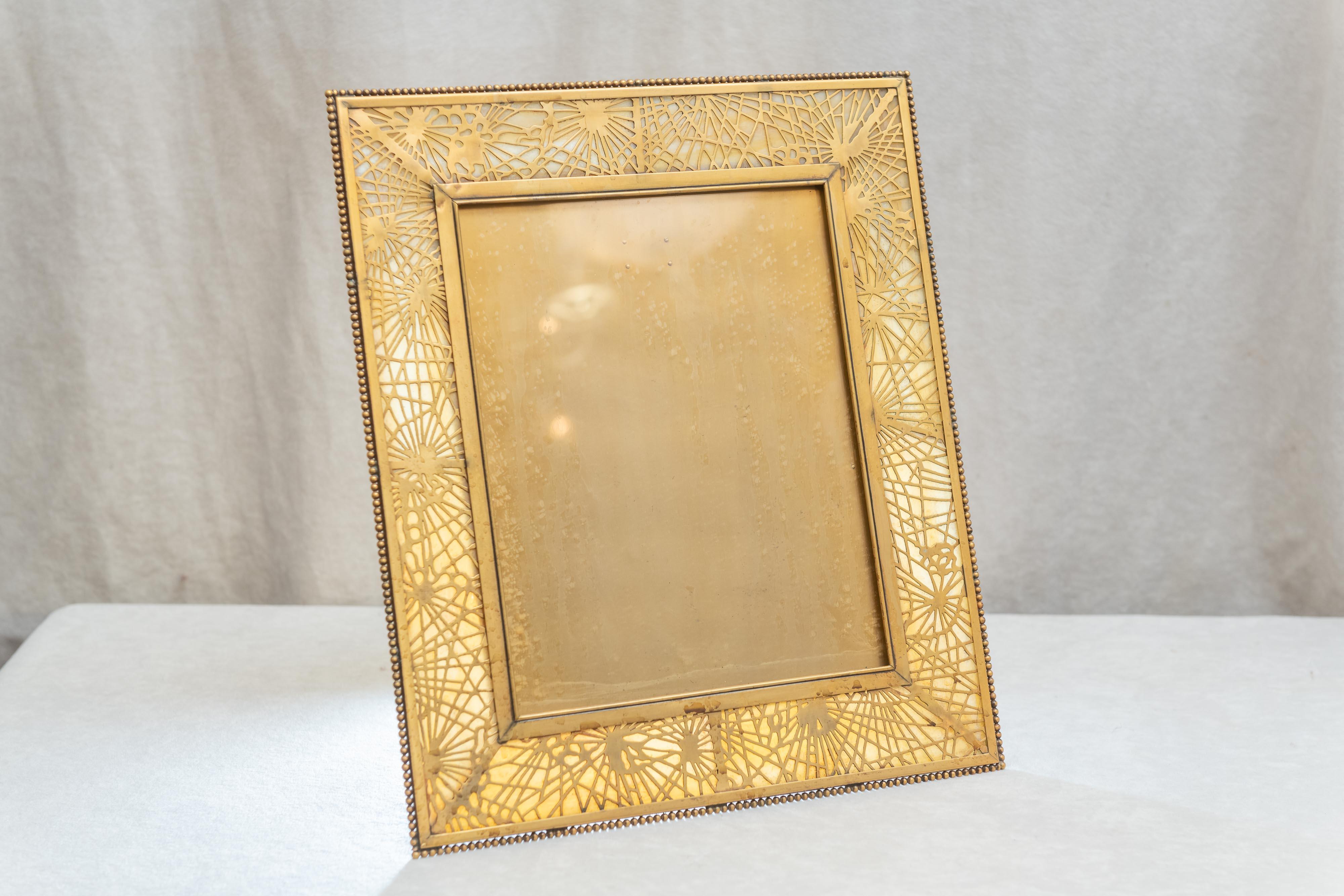 Early 20th Century Very Large Tiffany Studios Pine Needle Picture Frame in Gilt Metal and Glass