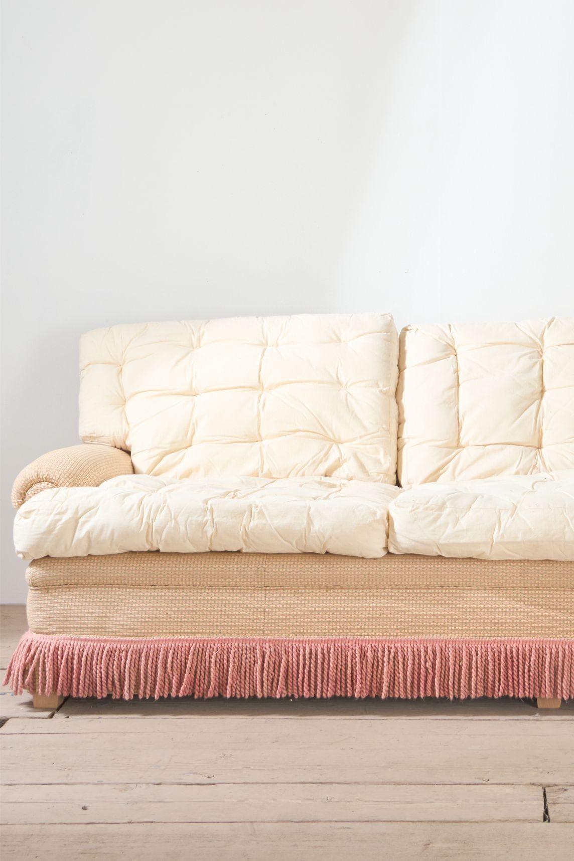 This is a very elegant 20th century country house sofa. Traditionally made and stunning design that will sit well in any interior. Standing on squat tapered beech legs and complete with sofa back and seat cushions that make this extremely