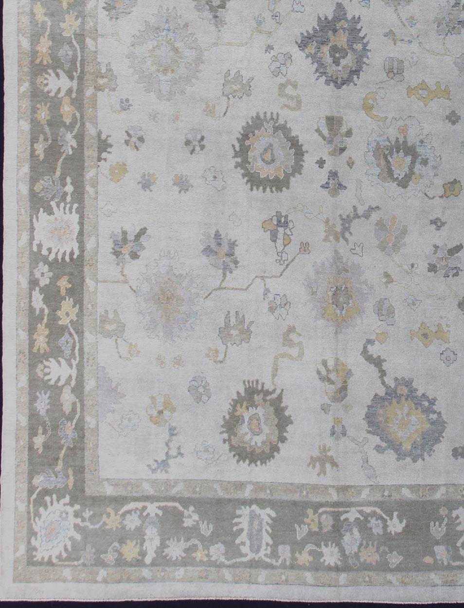 Turkish large Oushak rug with neutral color palette and all-over flower design, rug en-176598, country of origin / type: Turkey / Oushak

This large classic Oushak rug from Turkey features a subdued, neutral color palette and an all-over design of