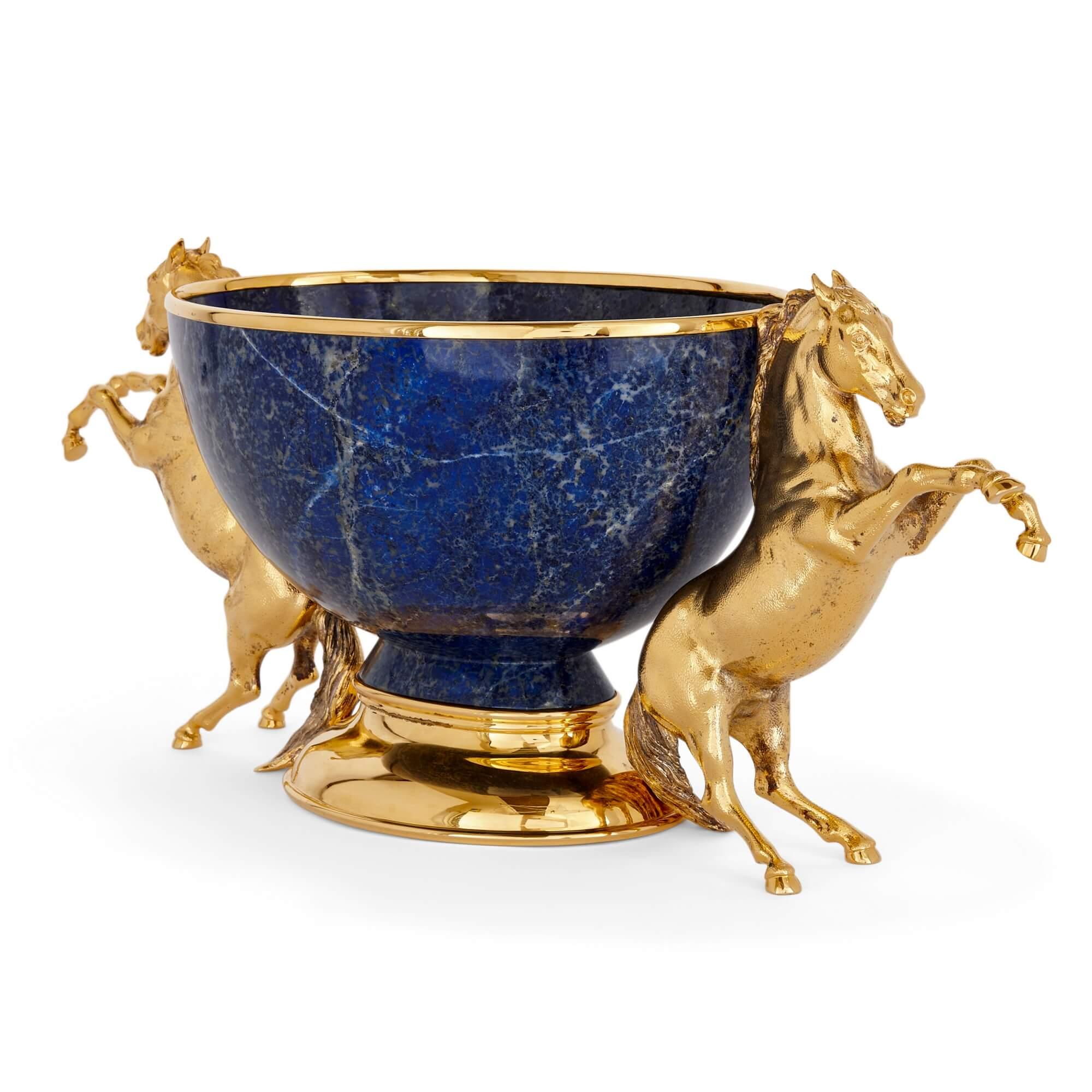 Very large vermeil and lapis lazuli centrepiece by Asprey 
English, c. 1980
Height 29cm, width 70cm, depth 27cm

Made by the renowned firm of Asprey in around 1980, this vermeil (silver gilt) and lapis lazuli centrepiece is of an impressive size and