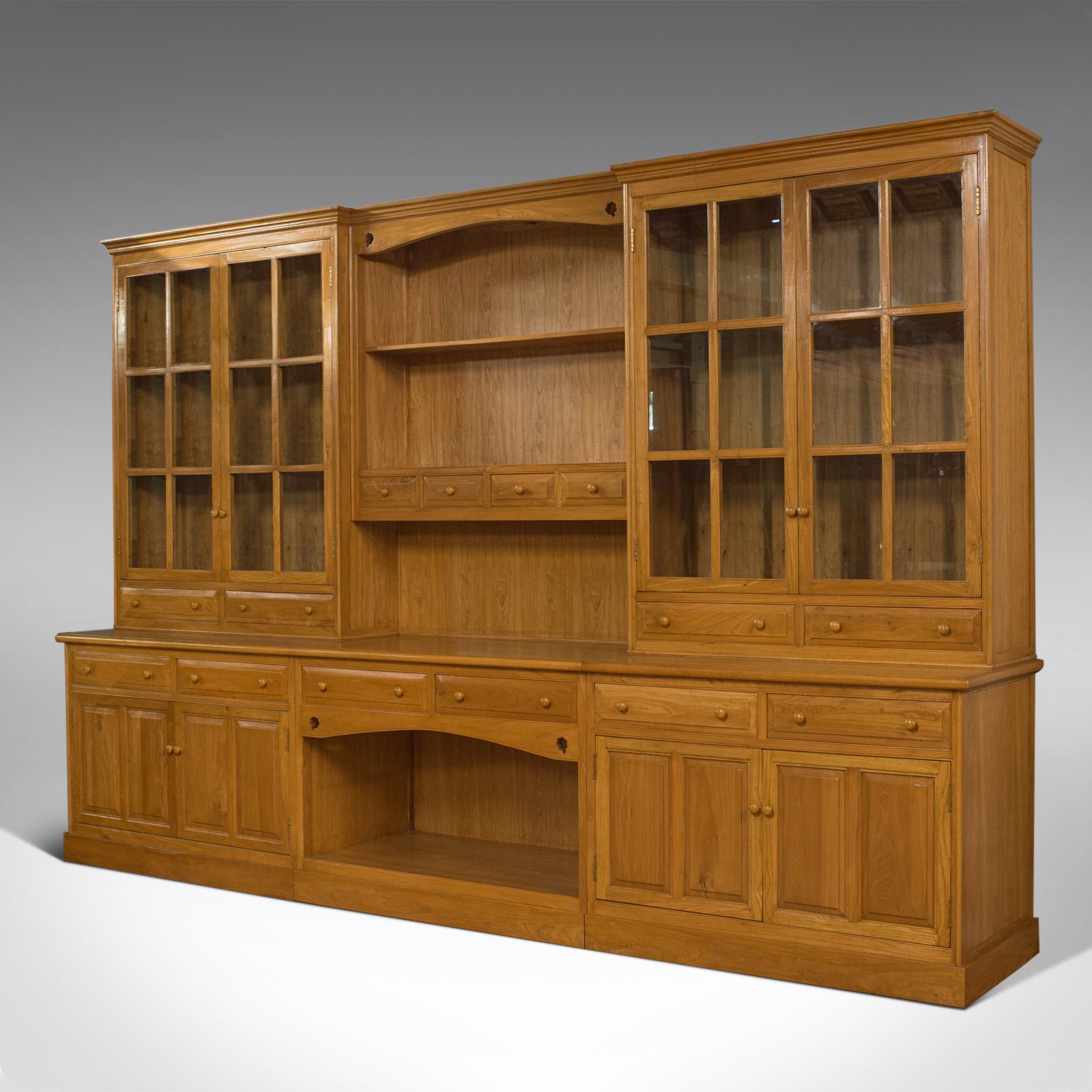 This is a very large, vintage dresser in the Victorian taste. A handmade, ash, kitchen cabinet of country house proportions, at over 12 feet wide and standing more than 8 feet tall and dating to the late 20th century.

Substantial cabinet of