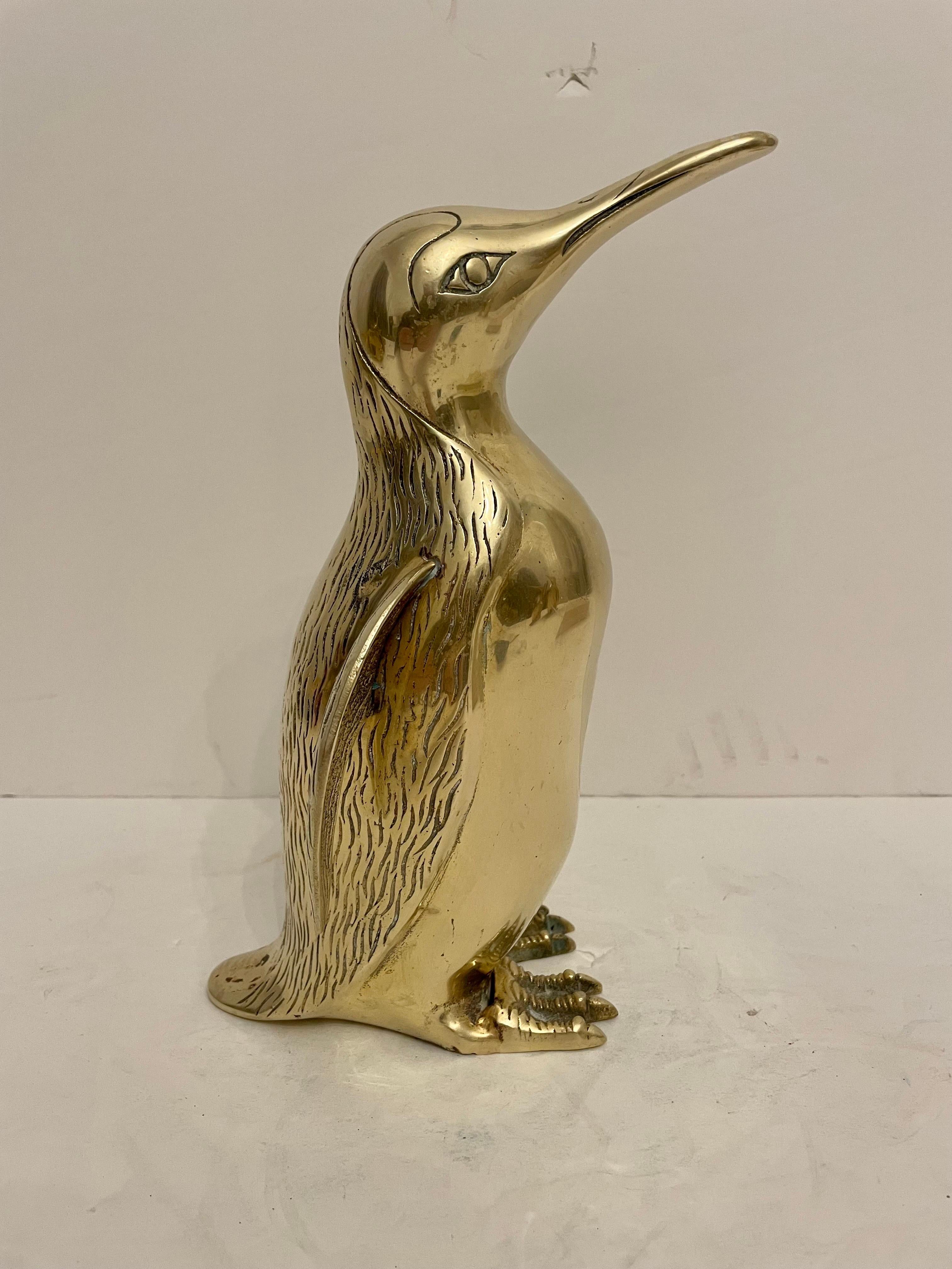 Very Large Vintage Hollywood Regency brass Penguin sculpture. Nicely detailed. Hand polished. Good overall condition. Dark spots are reflection of light in photos. Measures 10.5” tall x 6.5” wide x 7” deep. Last picture shows three that are