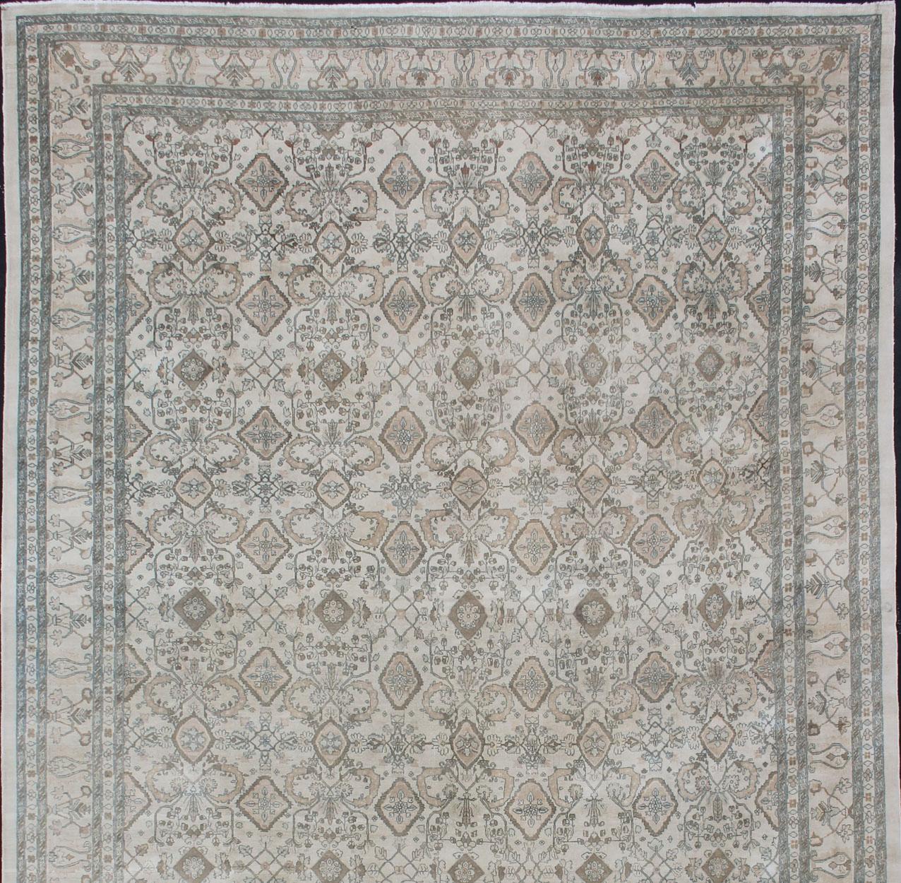 Vintage Sultanabad design rug in all over geometric with ivory background in light brown, blue, brown, charcoal, coral, salmon in sub-Geometric design, rug DSP878, country of origin / type: Iran / Sultanabad, circa 1970.

Measures: 16' x