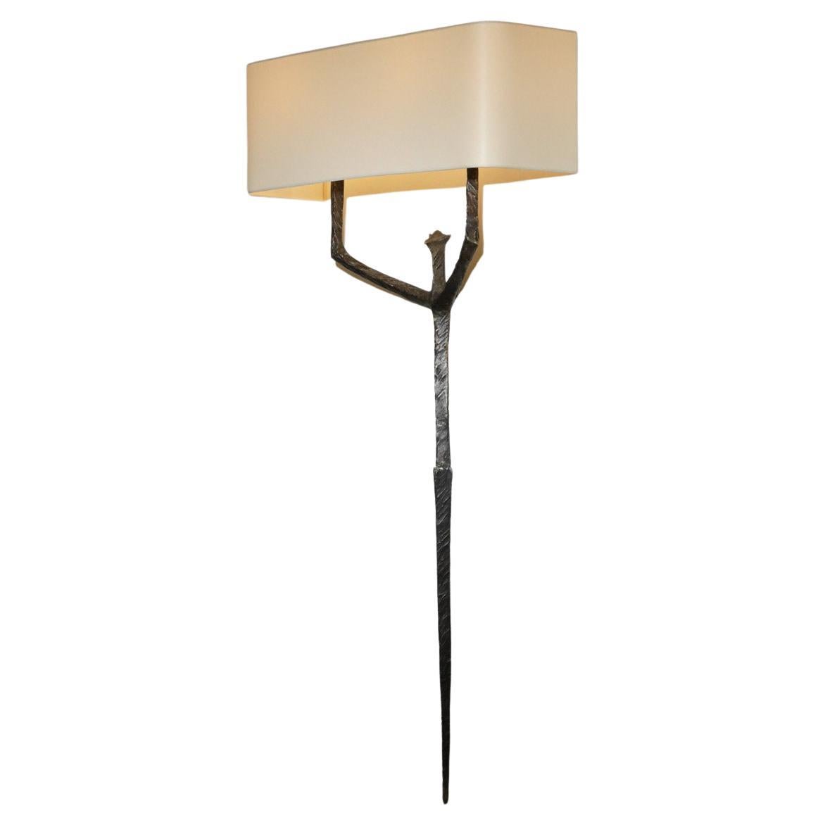 Very large wall lamp in the same style as its caryatid model created around 1950 by the designer and sculptor Felix Agostini. Wall lamp of the art deco period in solid bronze. Shade and electrical system refurbished, we recommend two LED bulbs type