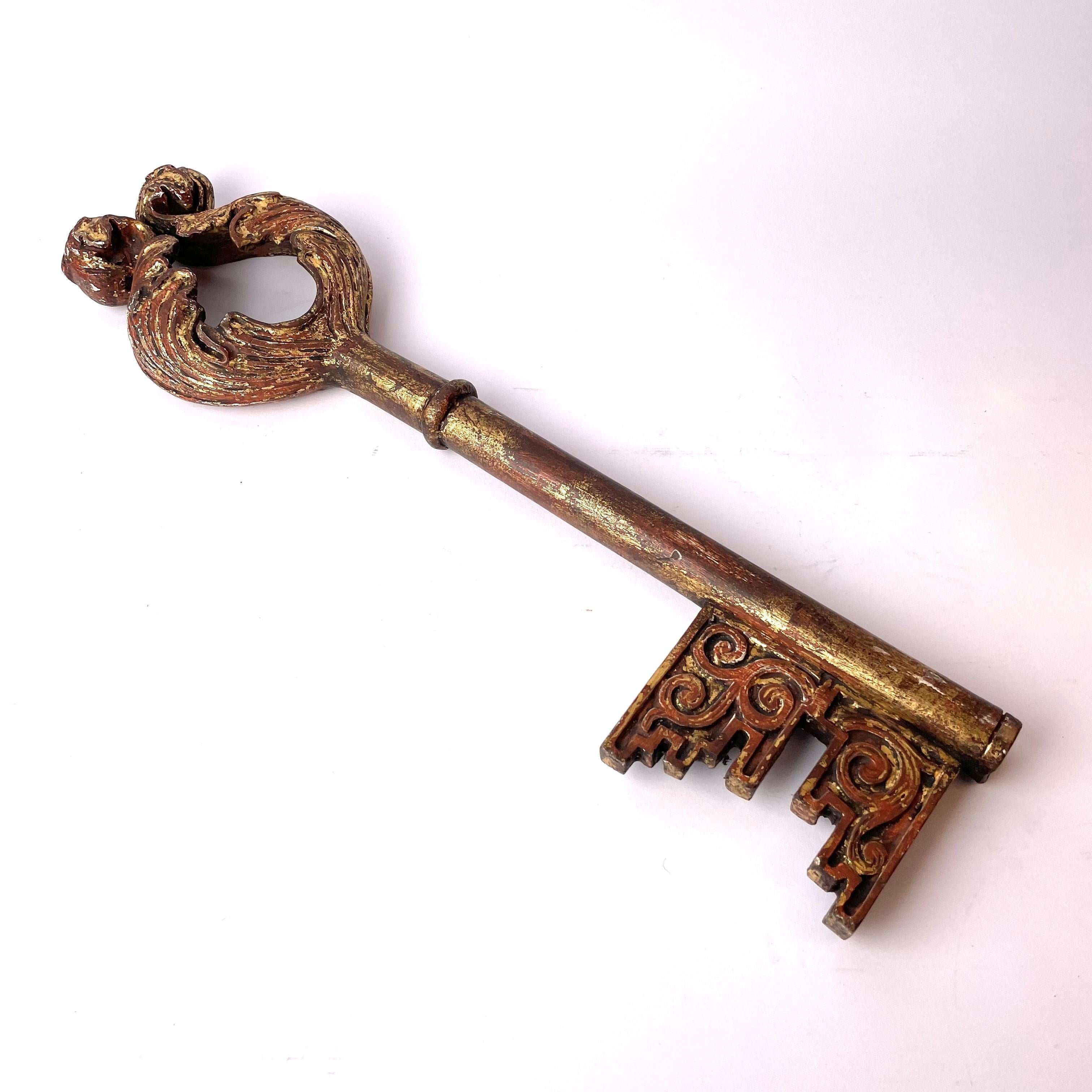 Very large woodcut and gilded key from the 17th century. Italian, possibly representing the Keys of St Peter. Probably from an Italian church. Nice patina and in good antique condition.

Wear consistent with age and use.
 