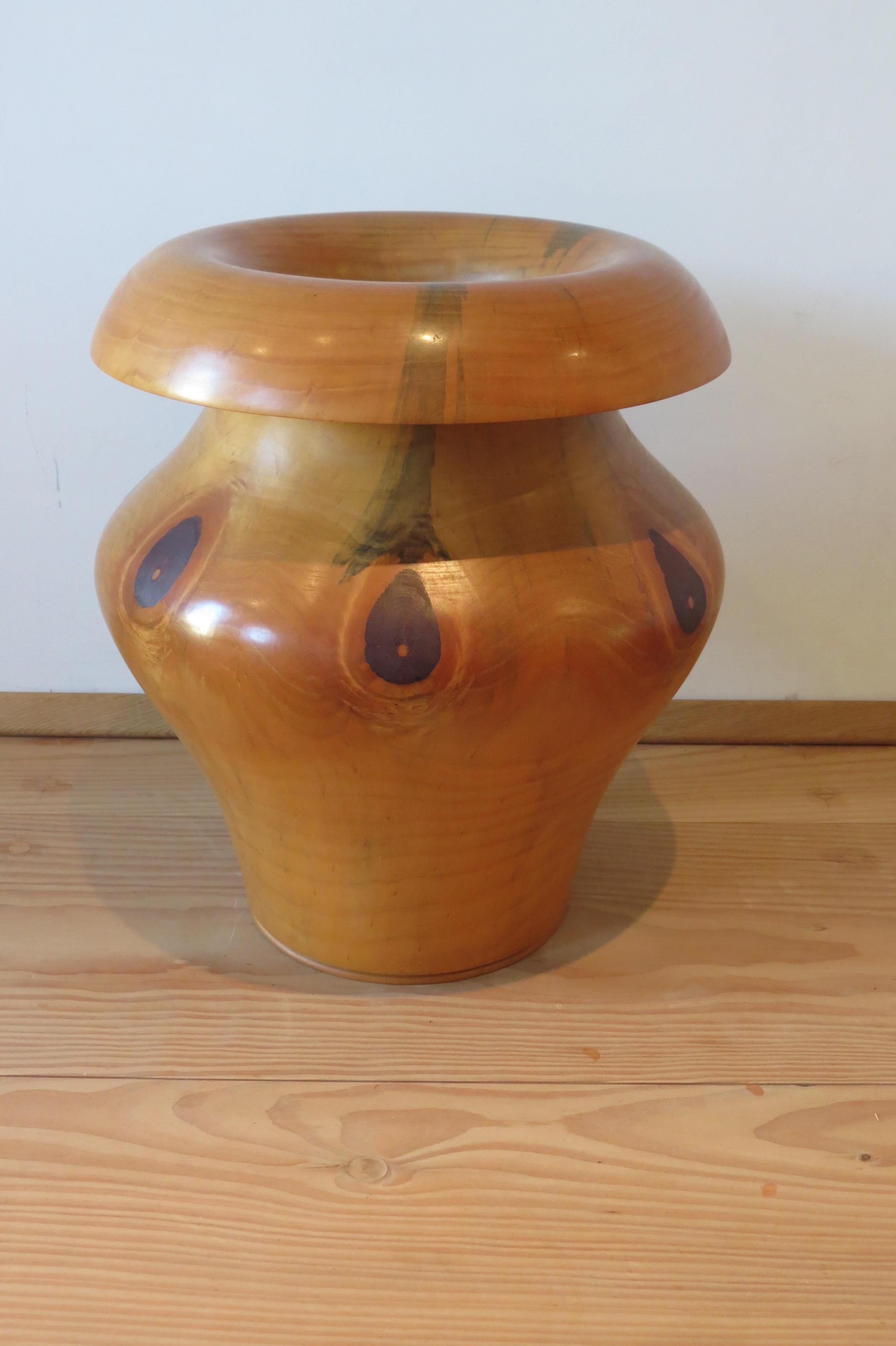 This is a wonderful hand crafted large wooden pot.  The piece has been hand turned and is made from Chile Pine and dates from the 1990s.   Wonderfully sculptural, this piece would have been incredibly difficult to turn due to its size and shape. Its