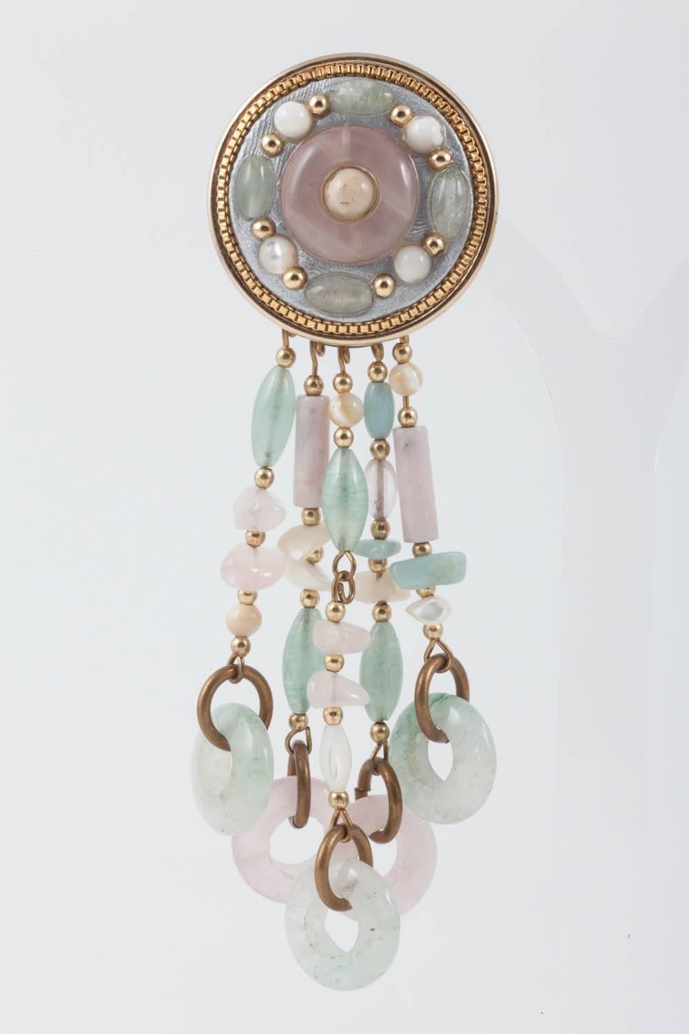 Very attractive long drop earrings, in jade , rose quartz, with mother of pearl chips, by Michal Golan of New York. The drop section of the earring is detachable (a ring, holding all five drops, lifts on or off the ear clip.), making them a very