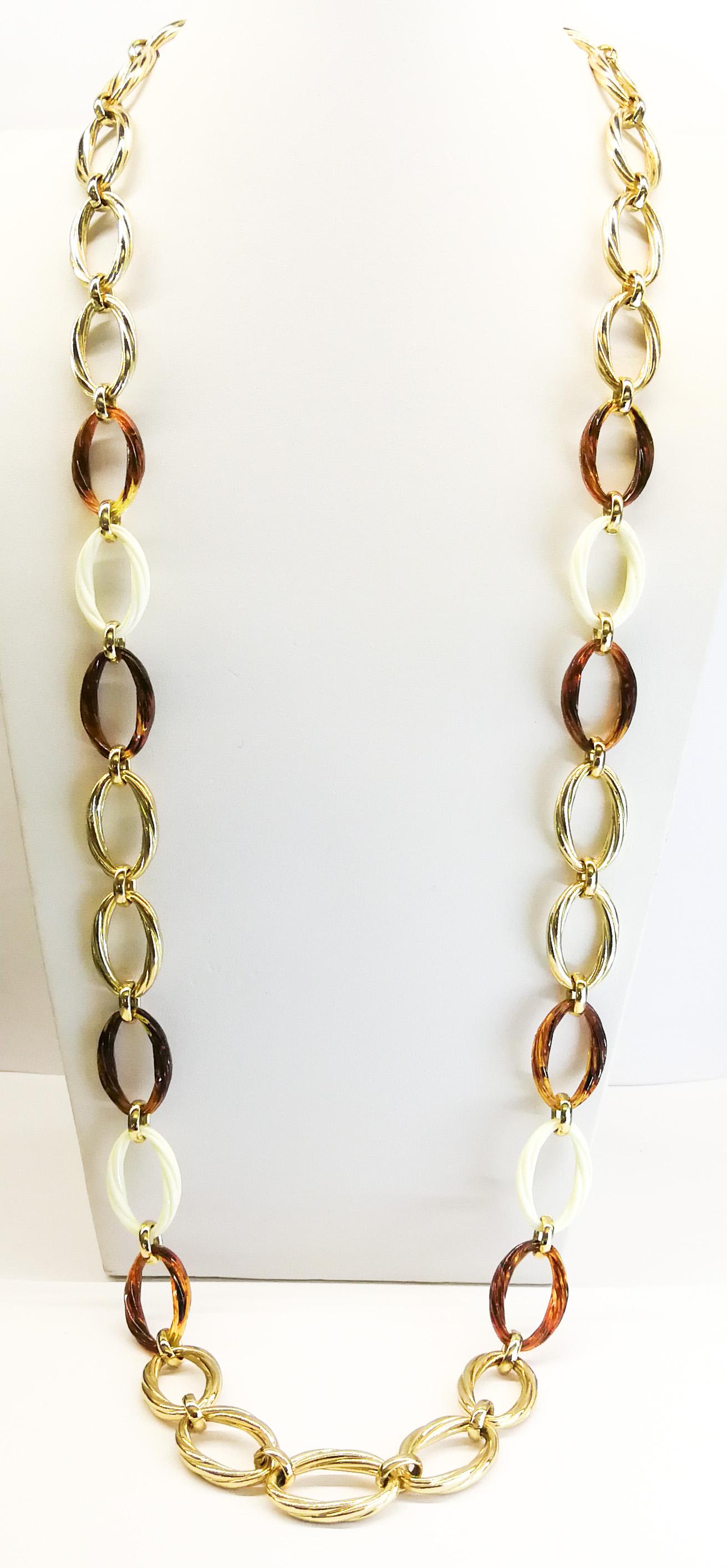 A very elegant, and wearable, very long chain necklace, with mixed faux ivory and tortoiseshell links, interspersed with the twisted gilt metal links, giving a smart but relaxed feel. Made in Germany by Henkel and Grosse, the celebrated and long