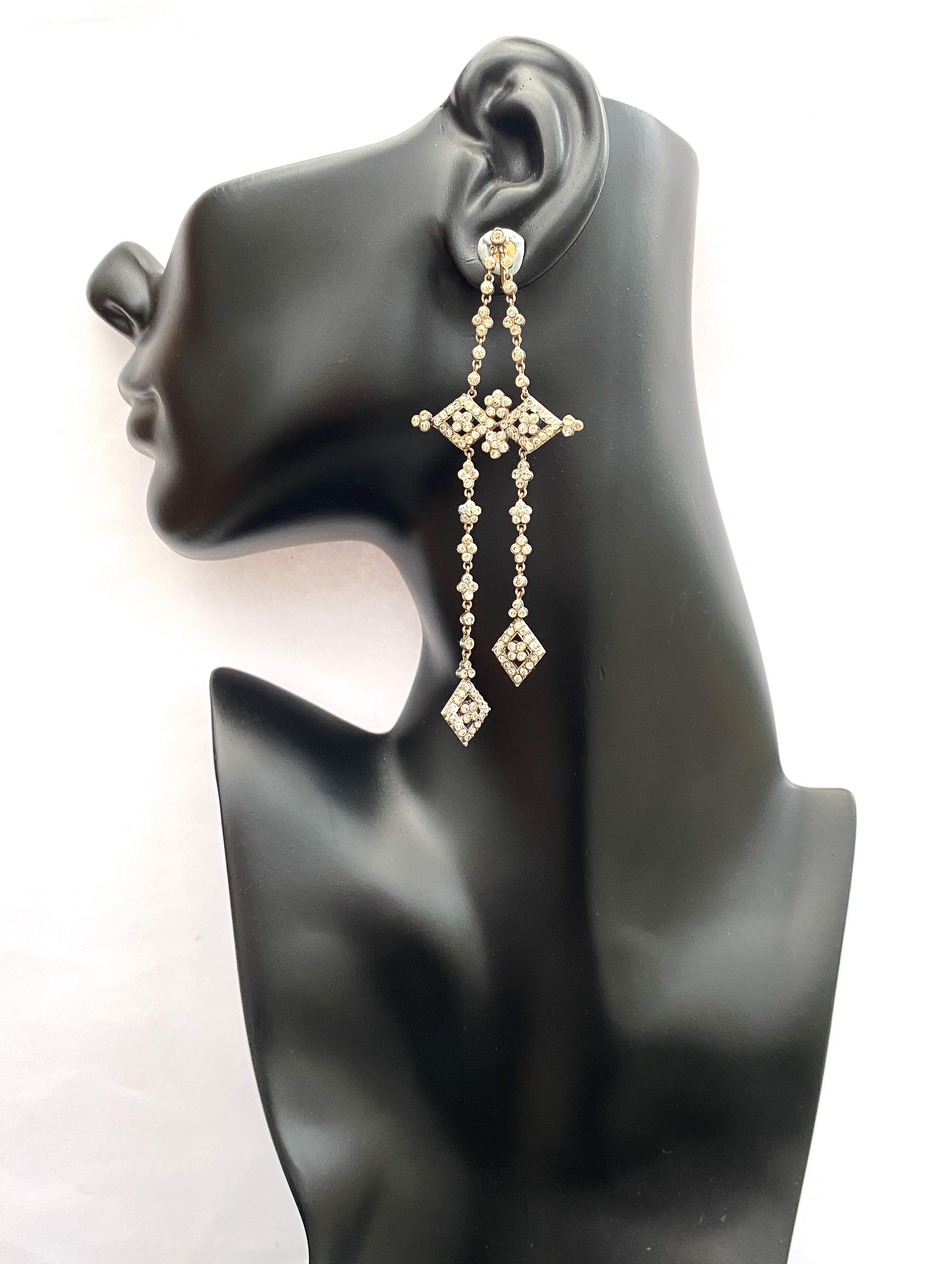 Art Deco Very long gold, silver and clear paste articulated drop earrings, French, 1920s For Sale