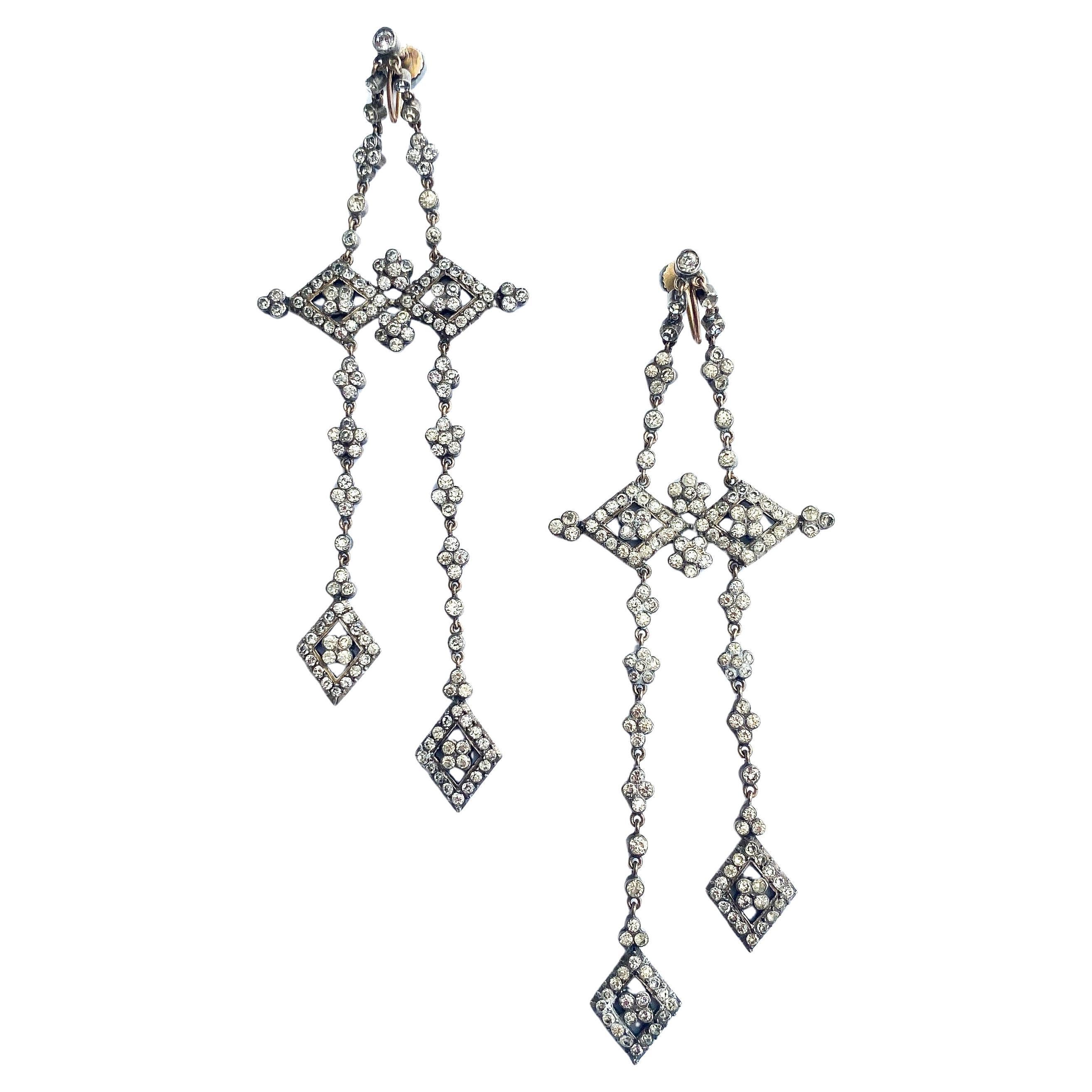 Very long gold, silver and clear paste articulated drop earrings, French, 1920s