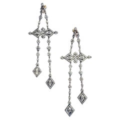 Very long gold, silver and clear paste articulated drop earrings, French, 1920s