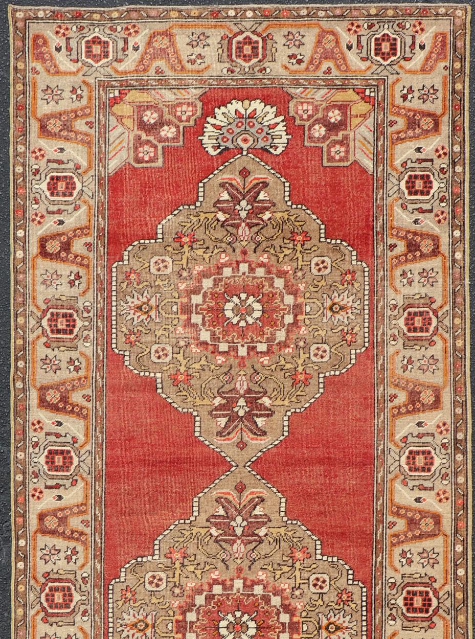 Very long Turkish Oushak runner with floral medallions on shades of red background rug cum-170, country of origin / type: Turkey / Oushak, Circa 1930's
This long Turkish Oushak gallery rug features a unique blend of colors and an intricately