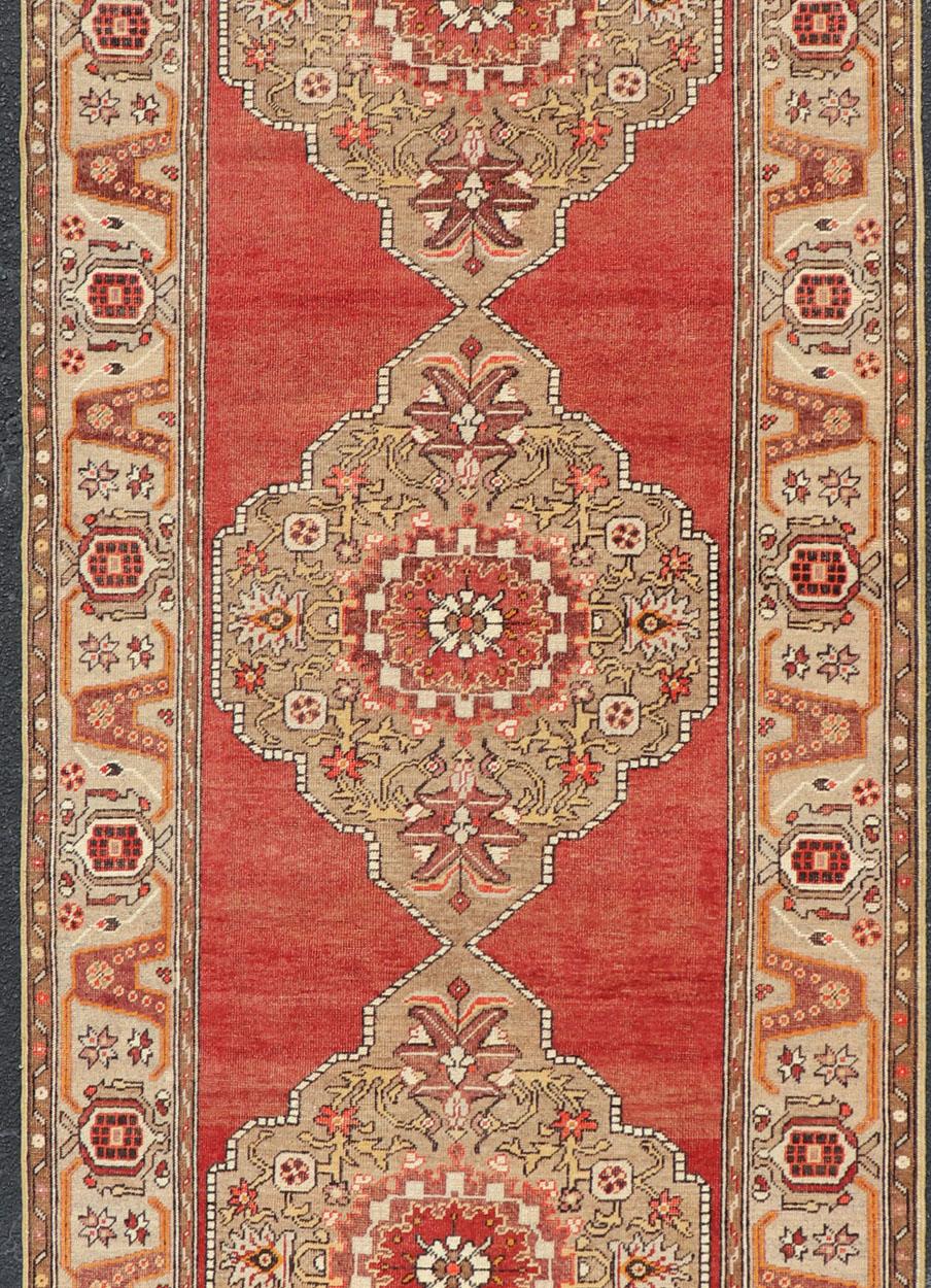 Hand-Knotted Very Long Old Turkish Oushak Runner with Floral and Geometrics in Red, Green For Sale