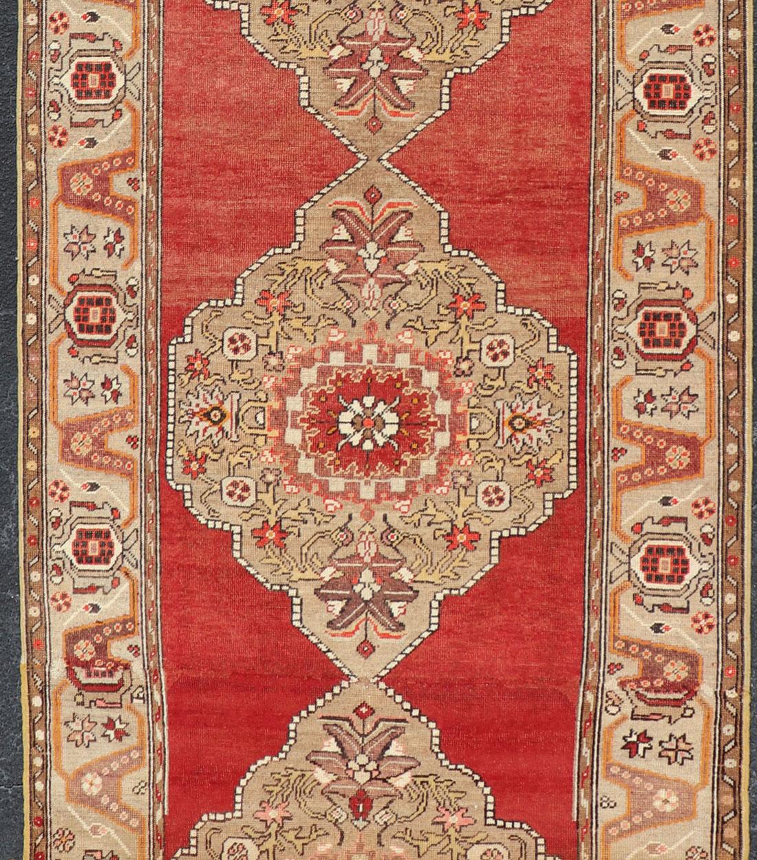 Very Long Old Turkish Oushak Runner with Floral and Geometrics in Red, Green In Good Condition For Sale In Atlanta, GA