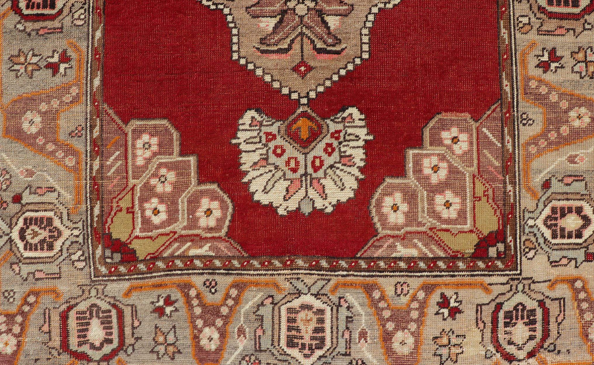 Mid-20th Century Very Long Old Turkish Oushak Runner with Floral and Geometrics in Red, Green For Sale